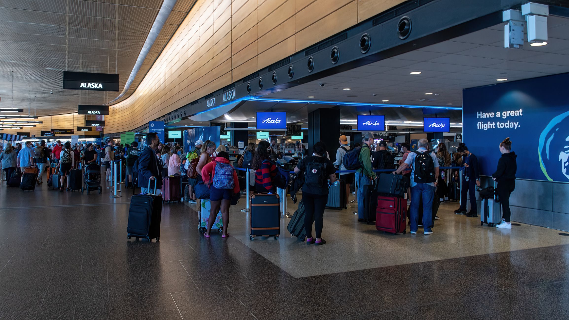 Passengers and More Passengers Wanting to Check in Luggage at Alaska Airlines