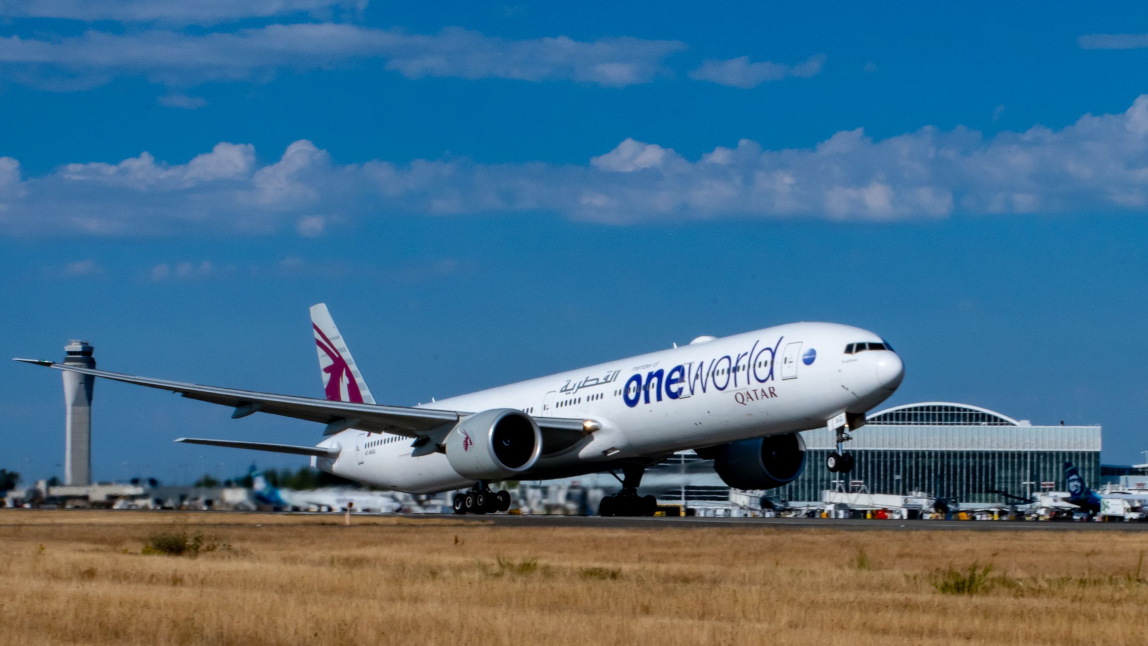 The OneWorld Qatar Airways 777-3DZ(ER) Rising From SeaTac
