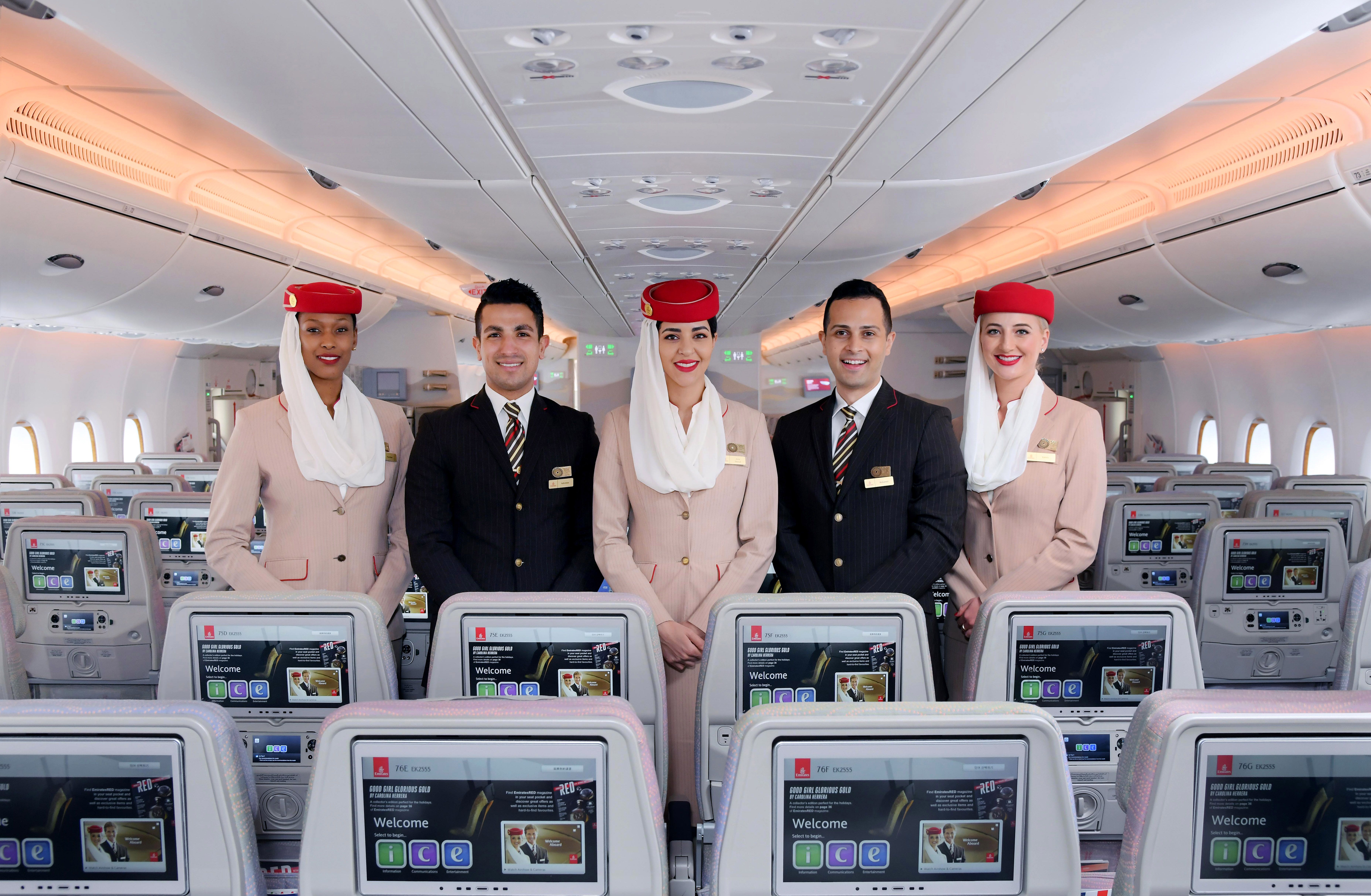 Emirates Cabin Crew in the economy class cabin.
