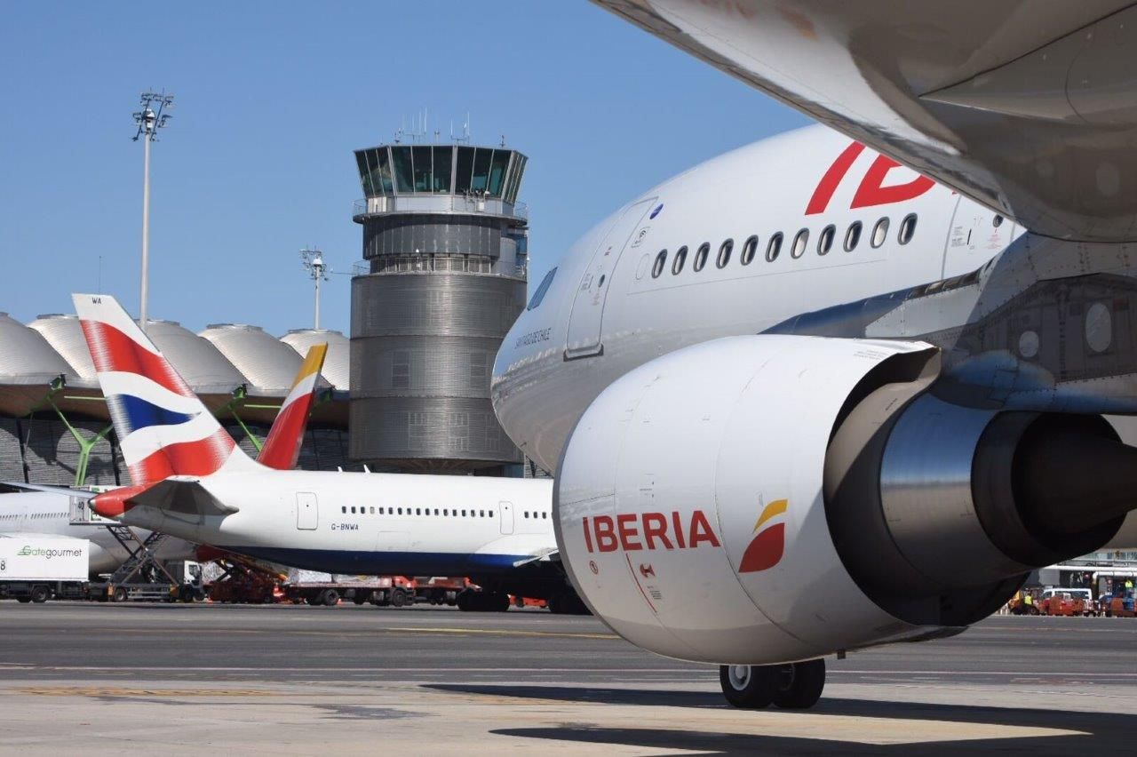 An Iberia jet in front of British Airways plane
