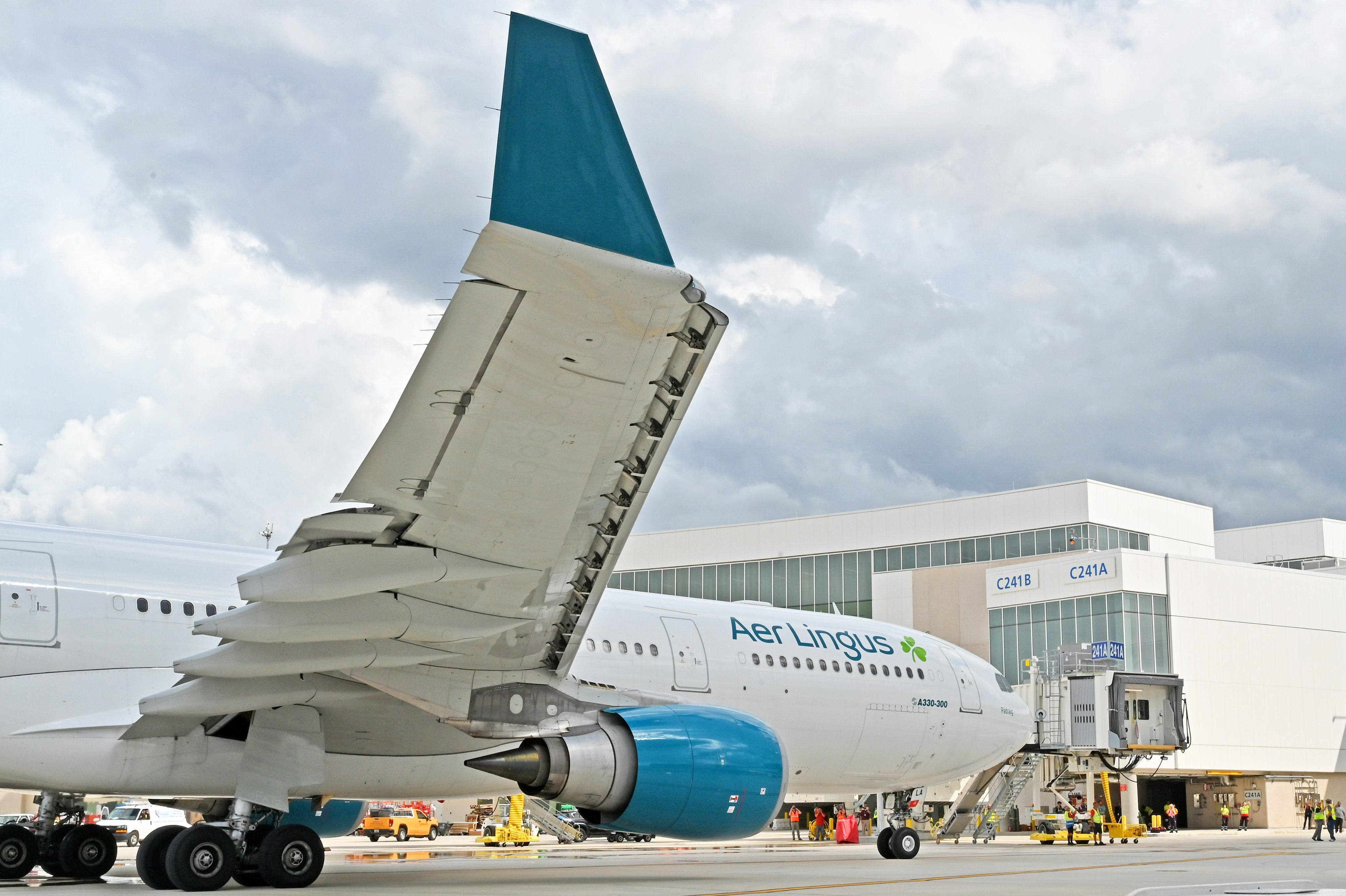 An Aer Lingus Airbus A330-300 aircraft parking in Terminal C at Orlando International Airport. 