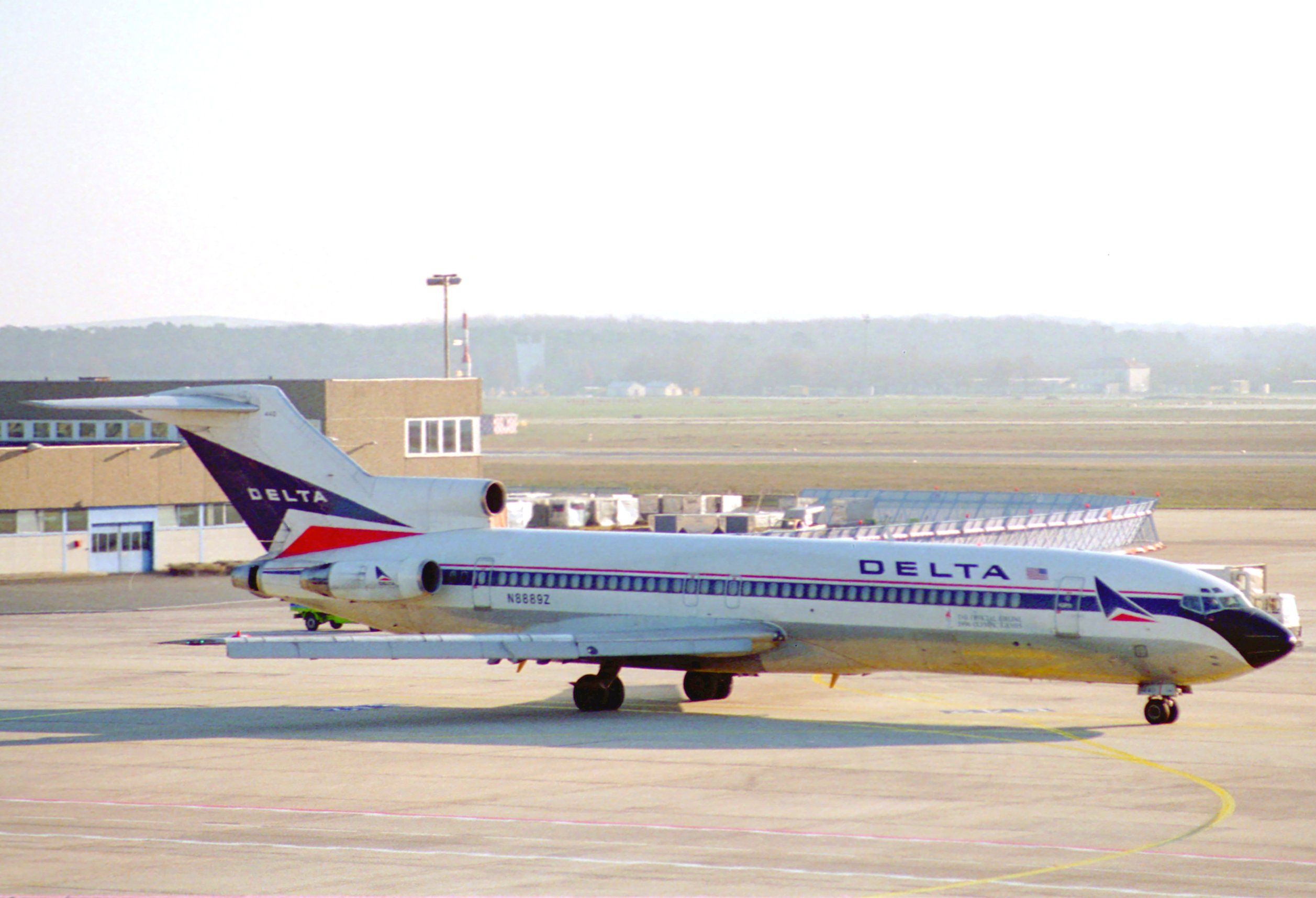 A Delta Air Lines Boeing 727 on an airport apron.