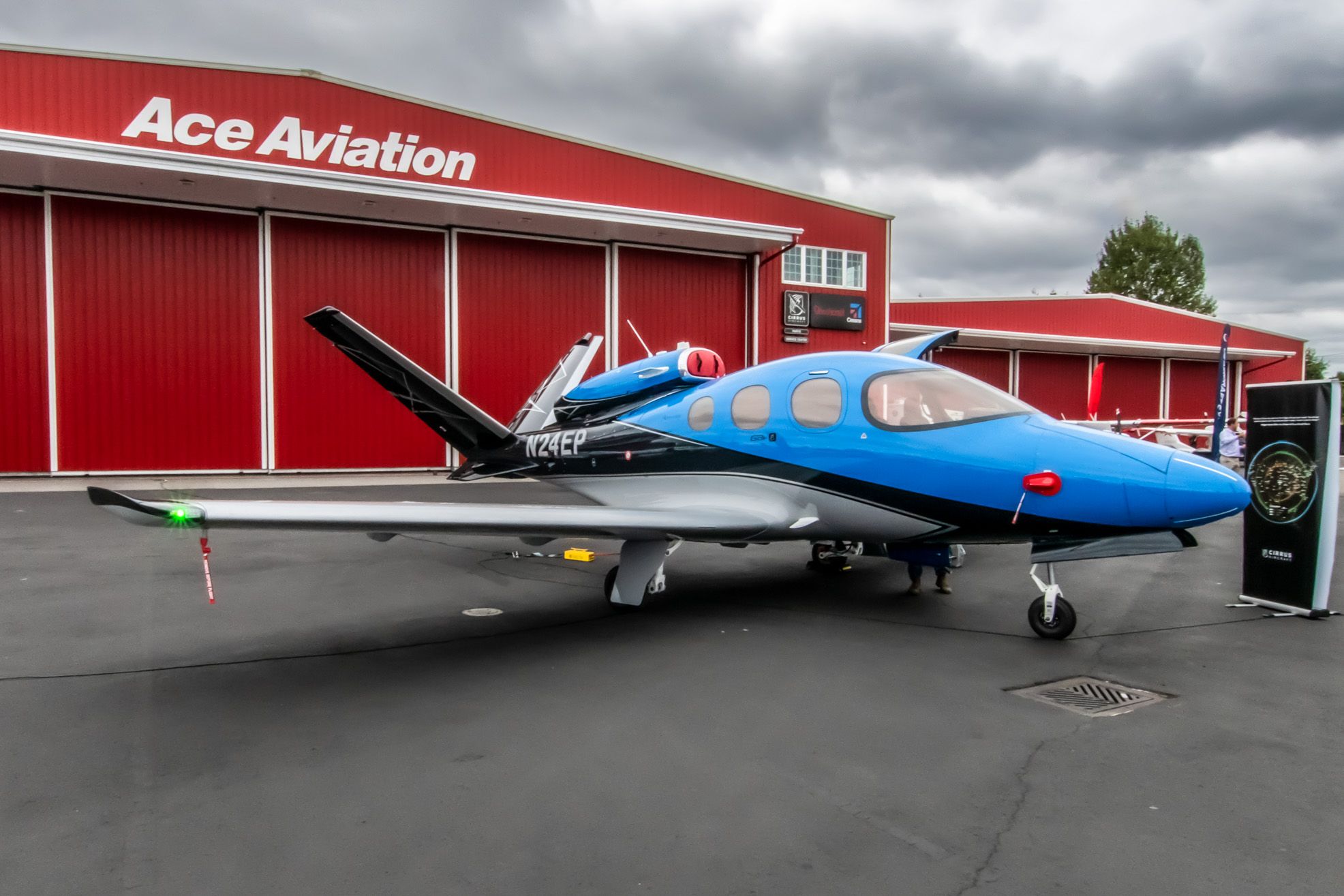 3x2 of Cirrus Vision Jet at Ace Aviation with overcast sky
