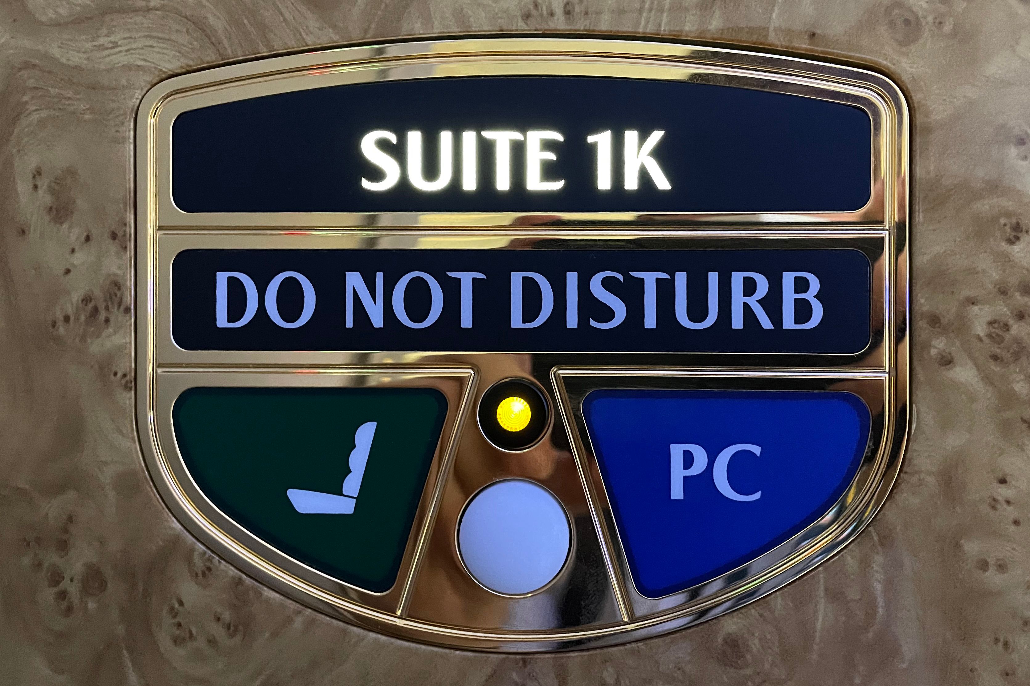 Emirates first class do not disturb sign