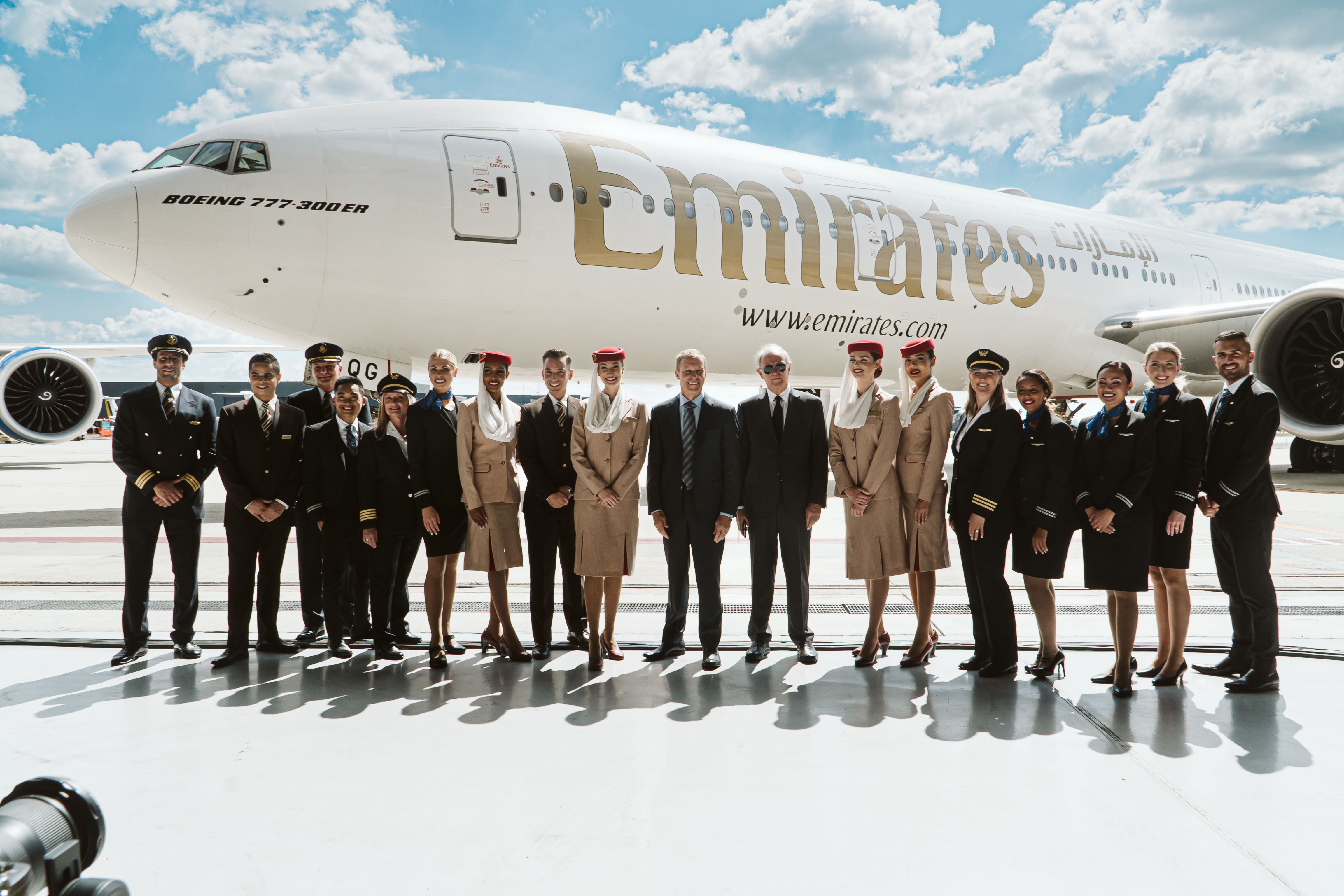 United and Emirates Crew with Scott Kirby and Tim Clark and a Emirates Boeing 777-300ER in the background