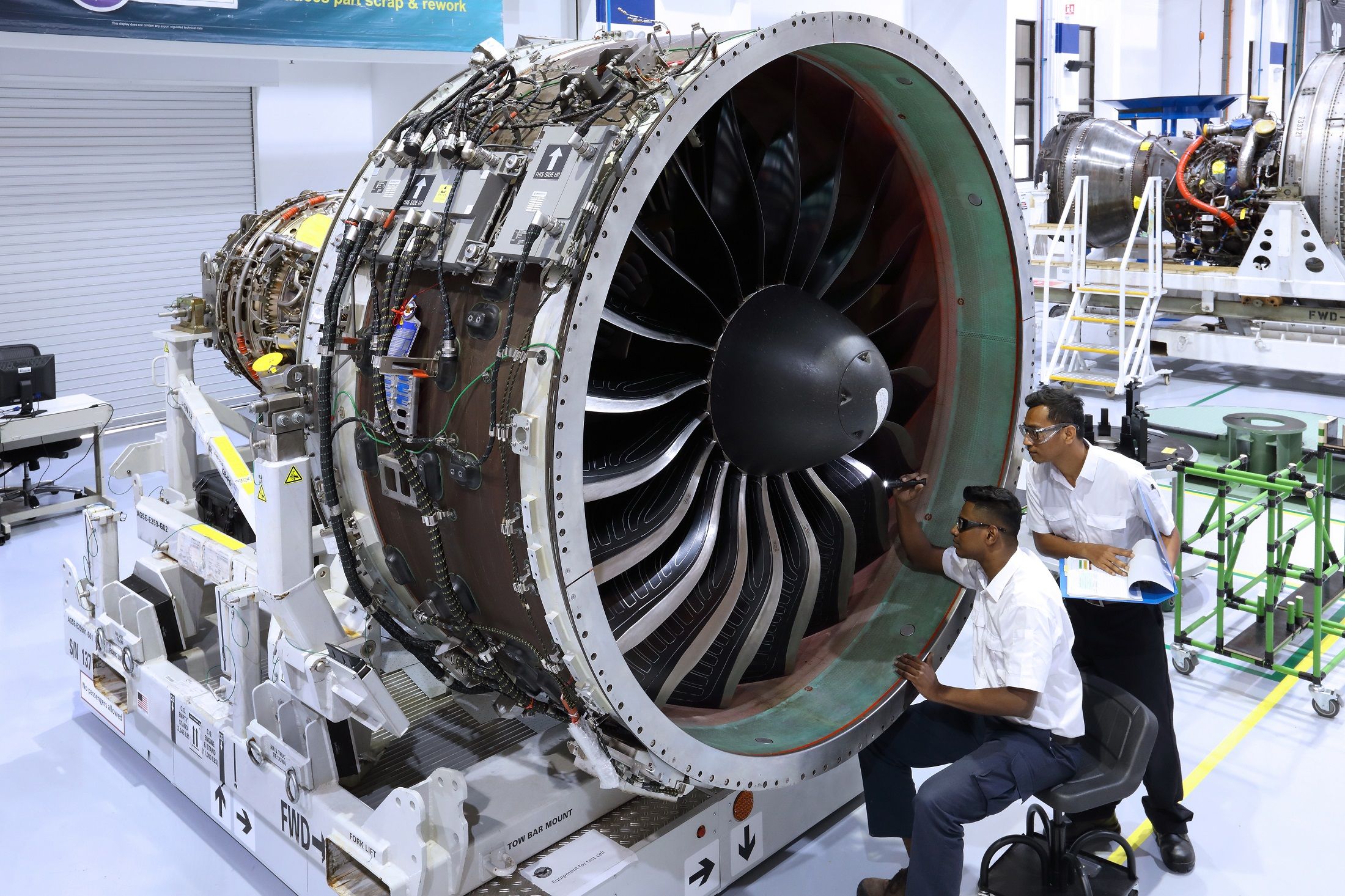 A Pratt & Whitney GTF engine being serviced in a Singaporean facility.