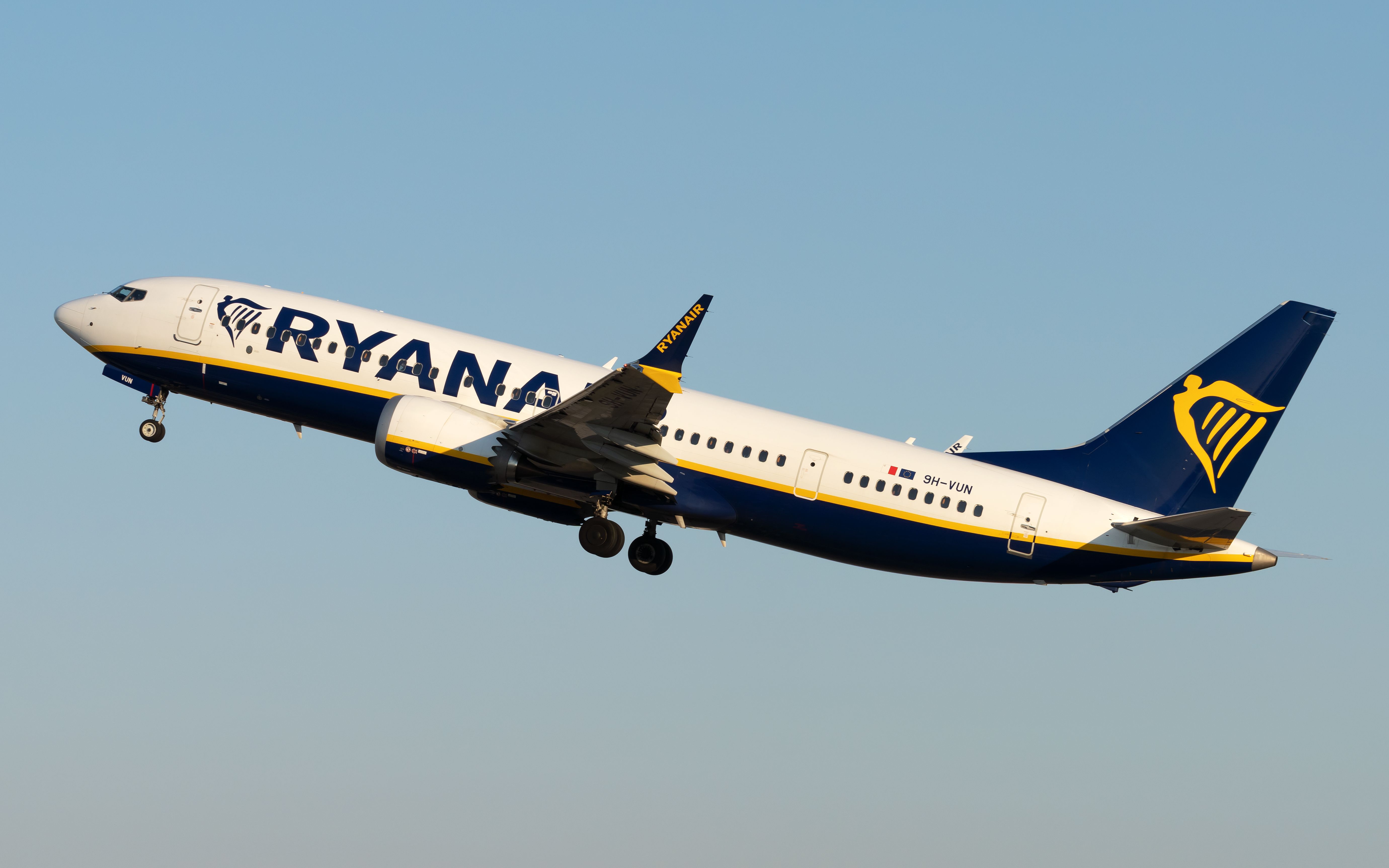 A Ryanair Boeing 737-8 MAX flying in the sky.