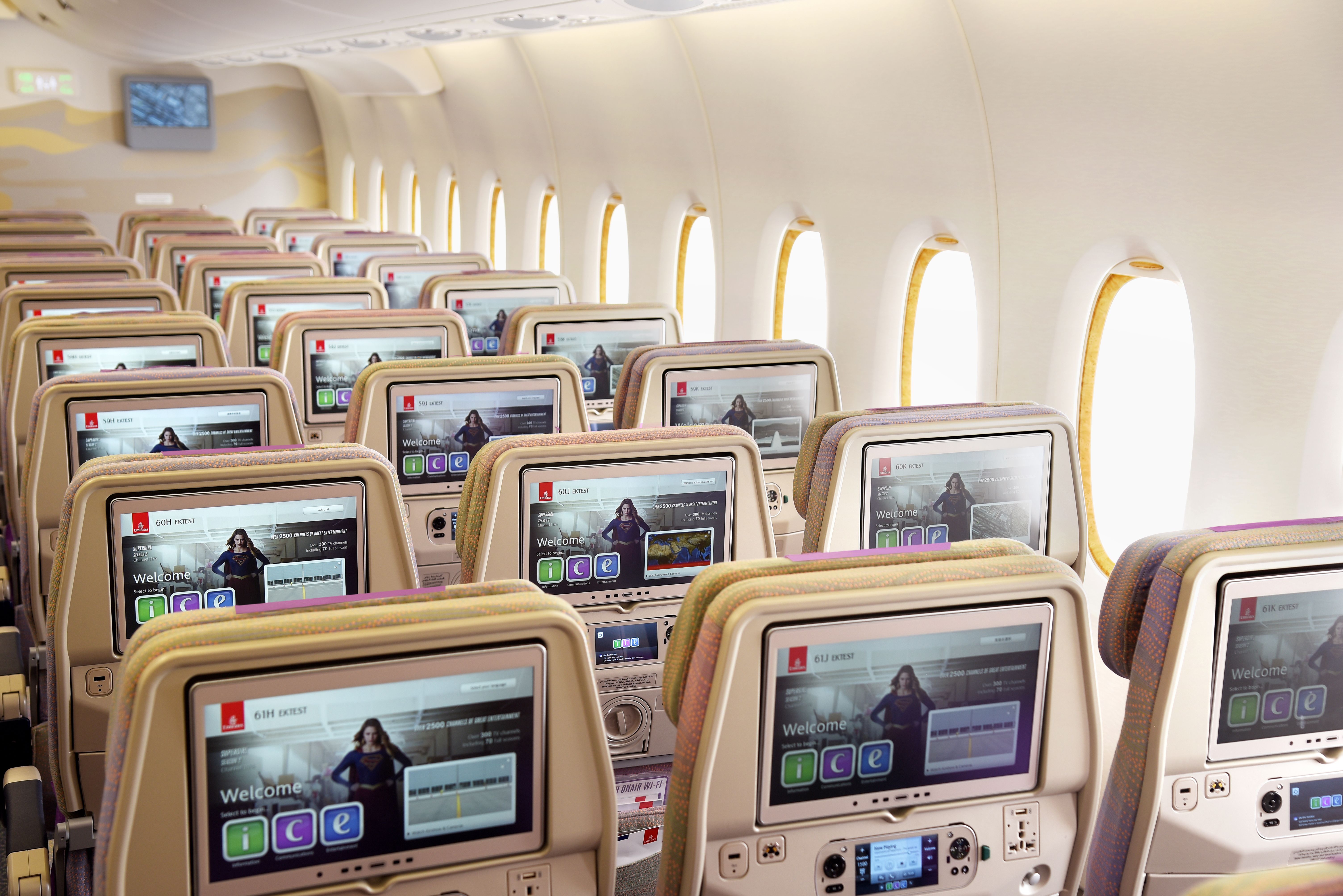 Several Emirates economy class seats with IFE Screens.