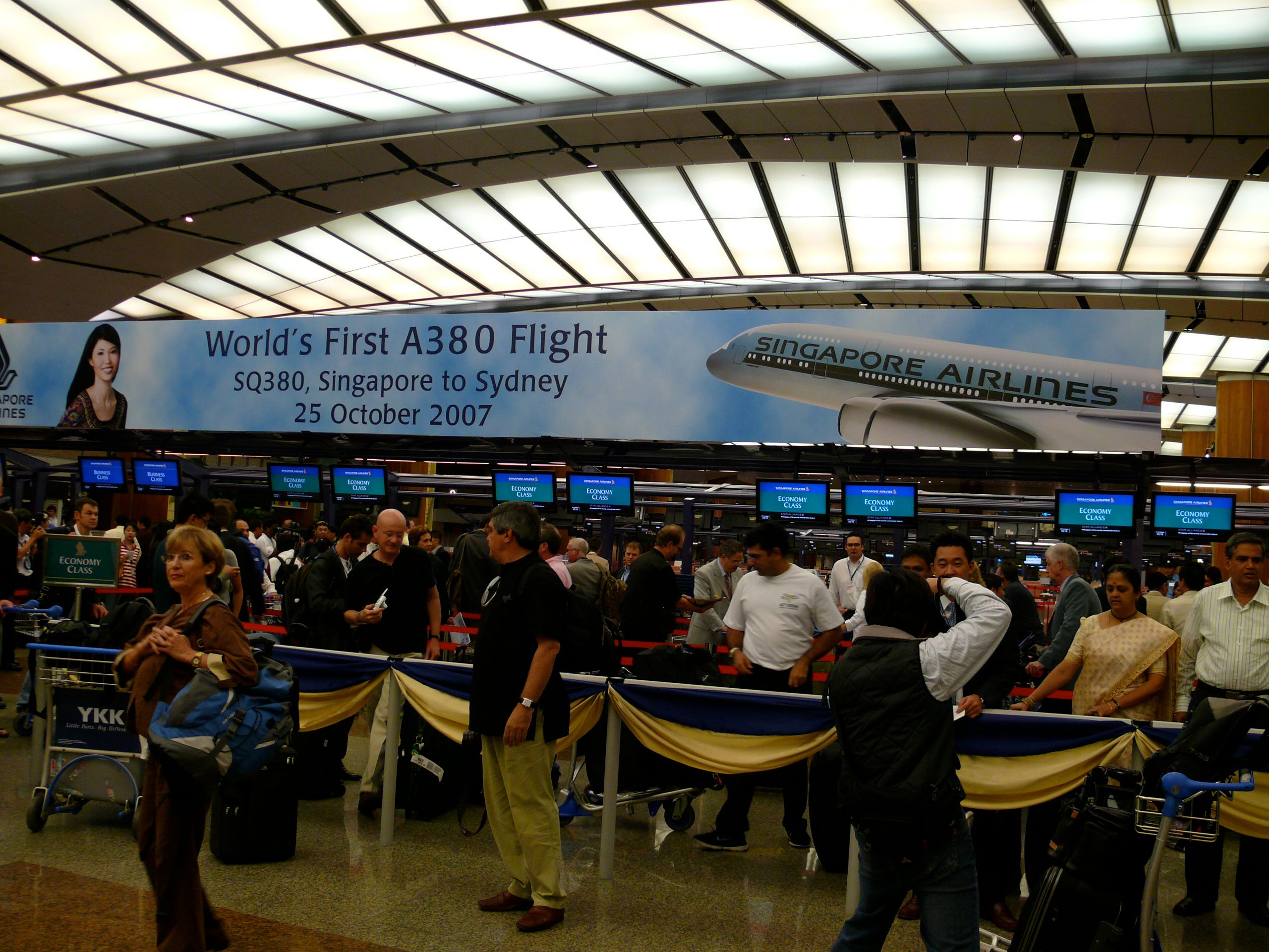 Passengers at check-in during the inaugural flight of the Airbus A380