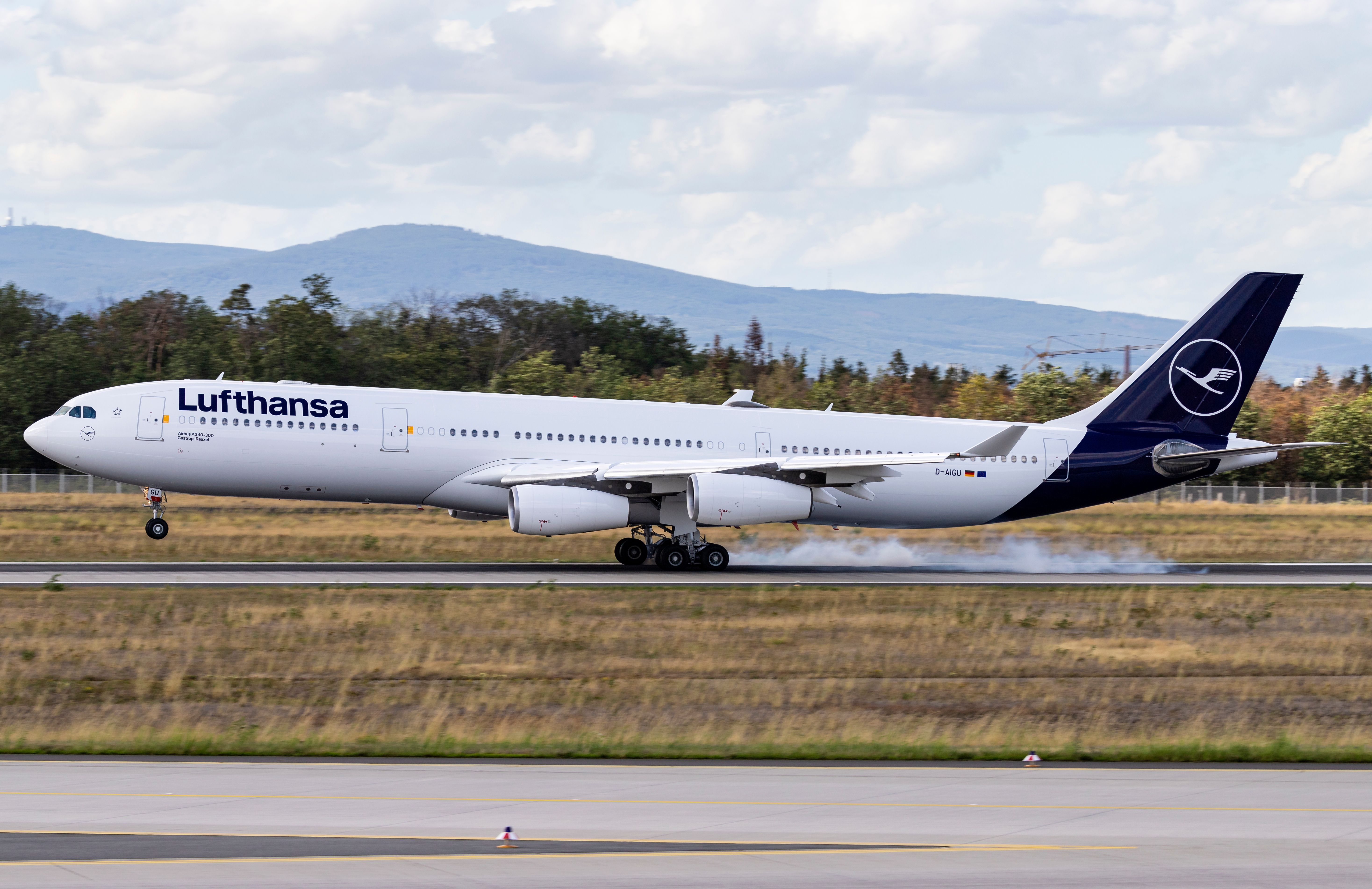 Lufthansa Airbus A340-300 landing on a runway.