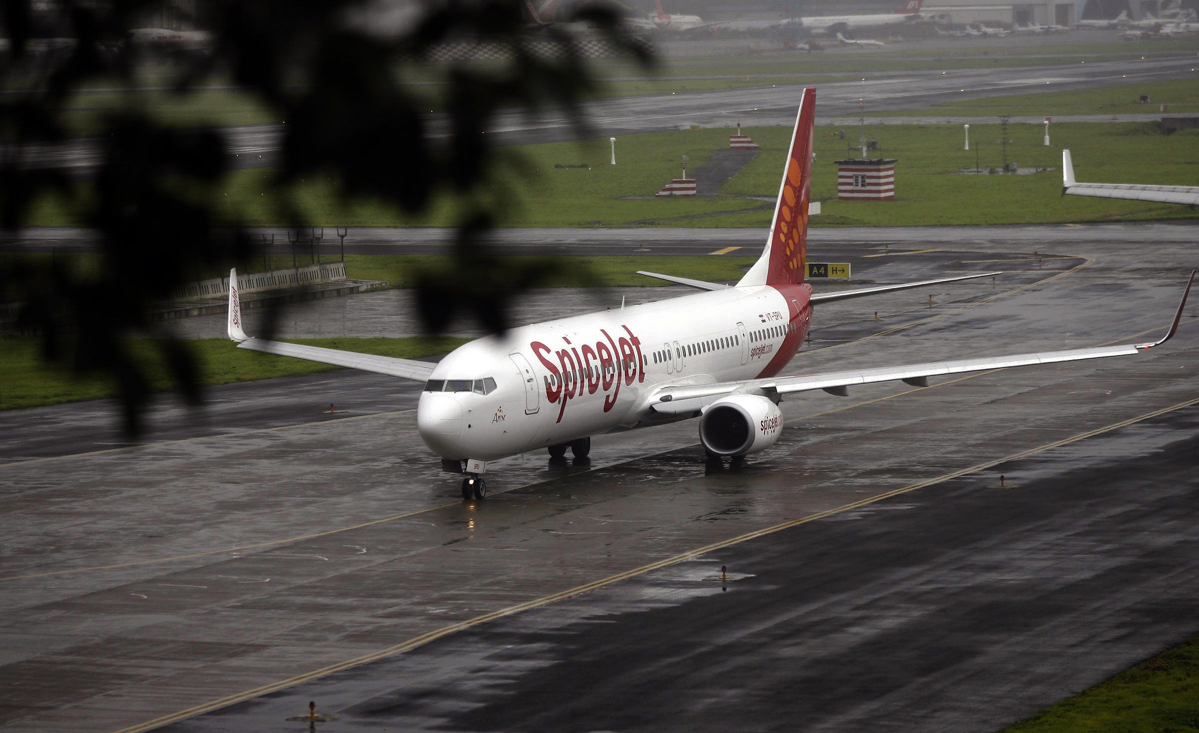 SpiceJet Boeing 737 taxis towards takeoff at Mumbai airport 