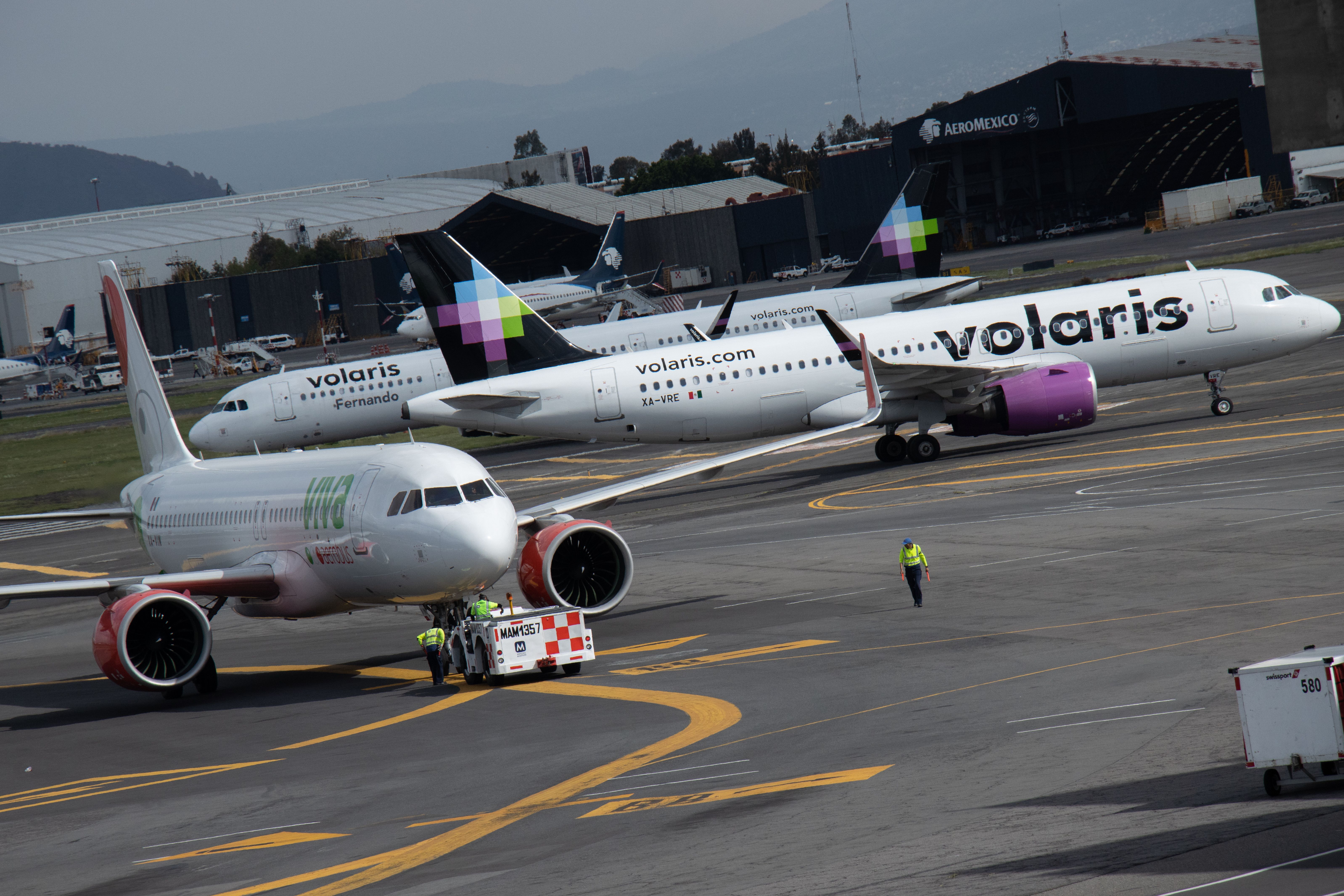 A Viva Aerobus and two Volaris aircrafft