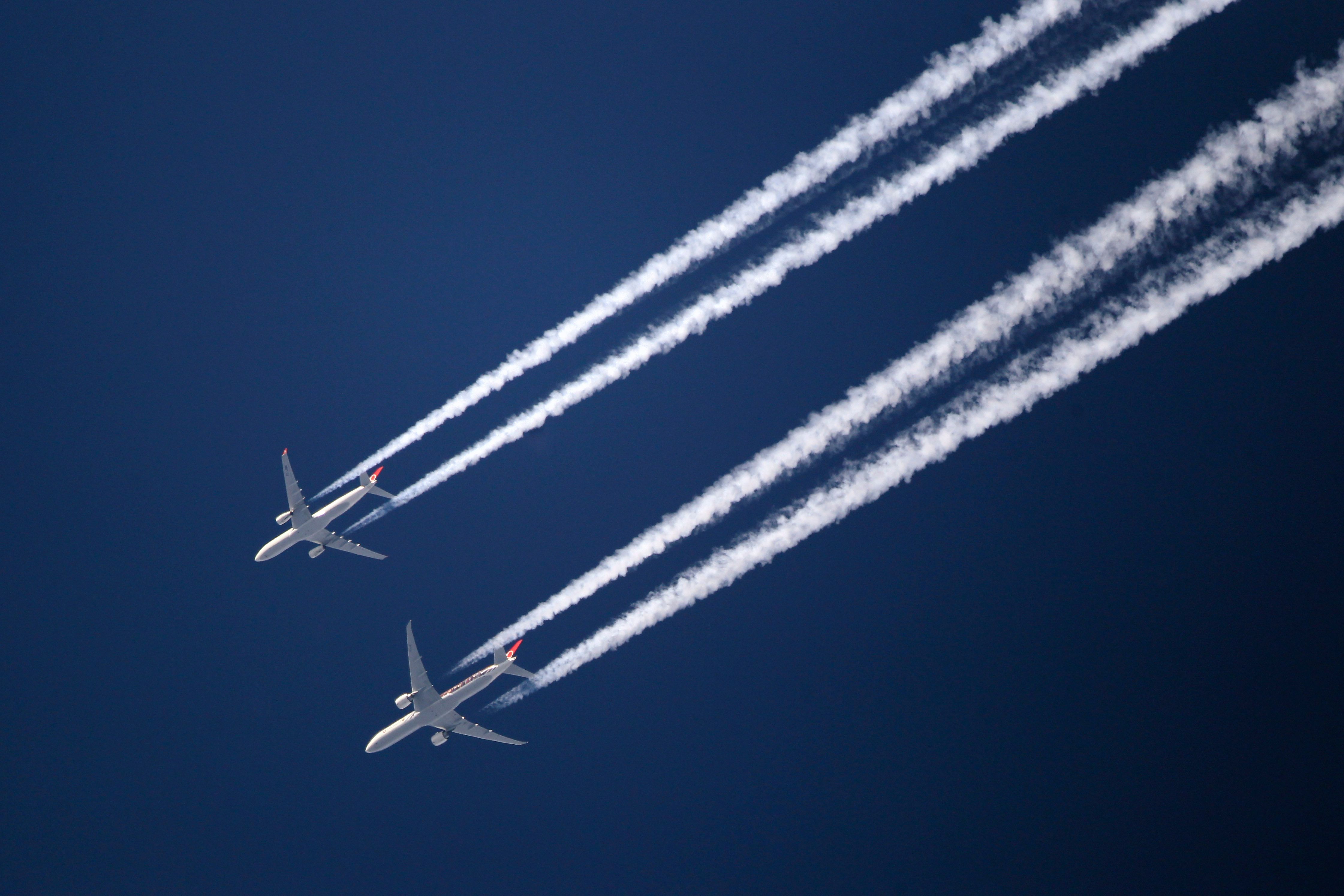 Contrails of two planes in the sky