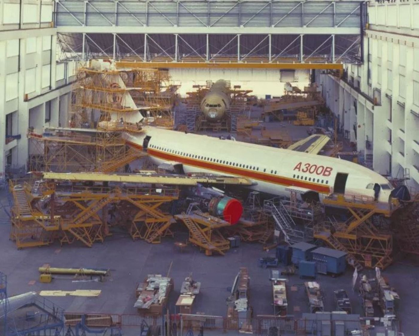 An Airbus A300B being manufactured in a facility.