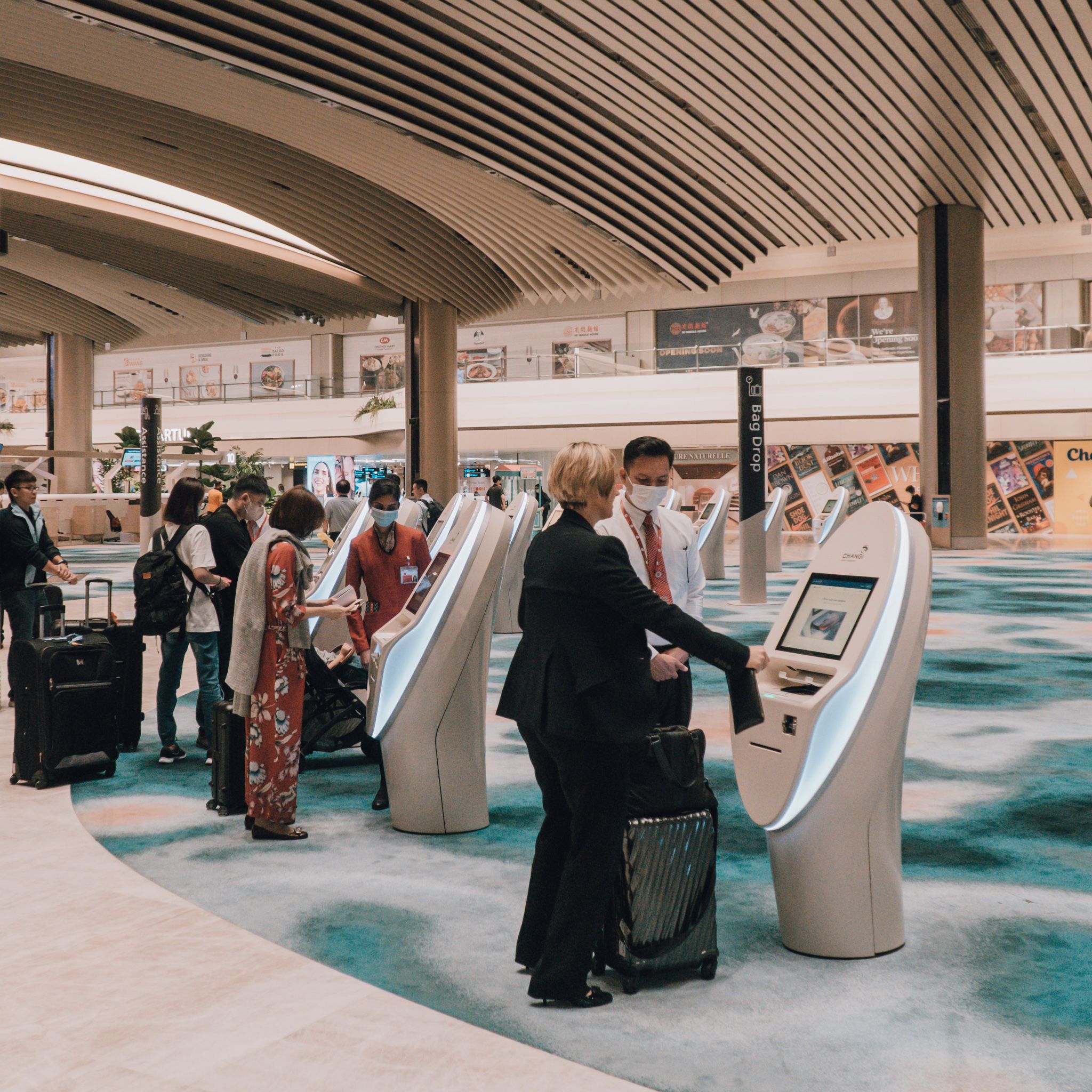Singapore Changi T2 SIA passengers at the automated check-in kiosk
