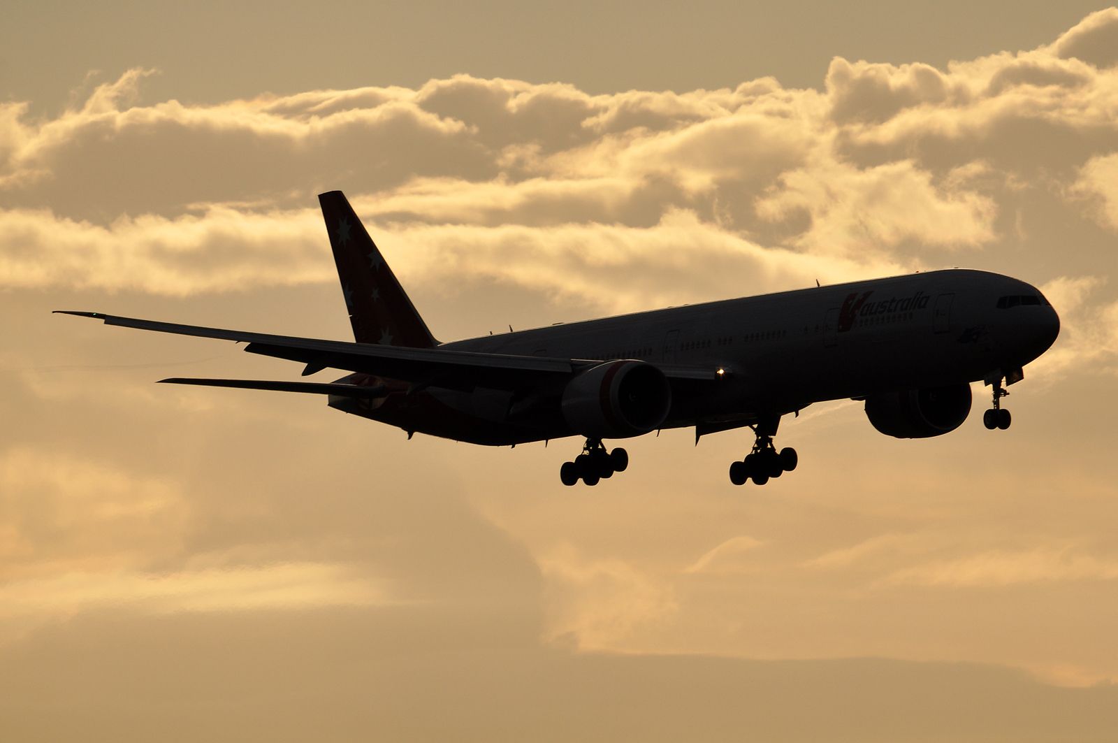 Boeing 777 silhouetted