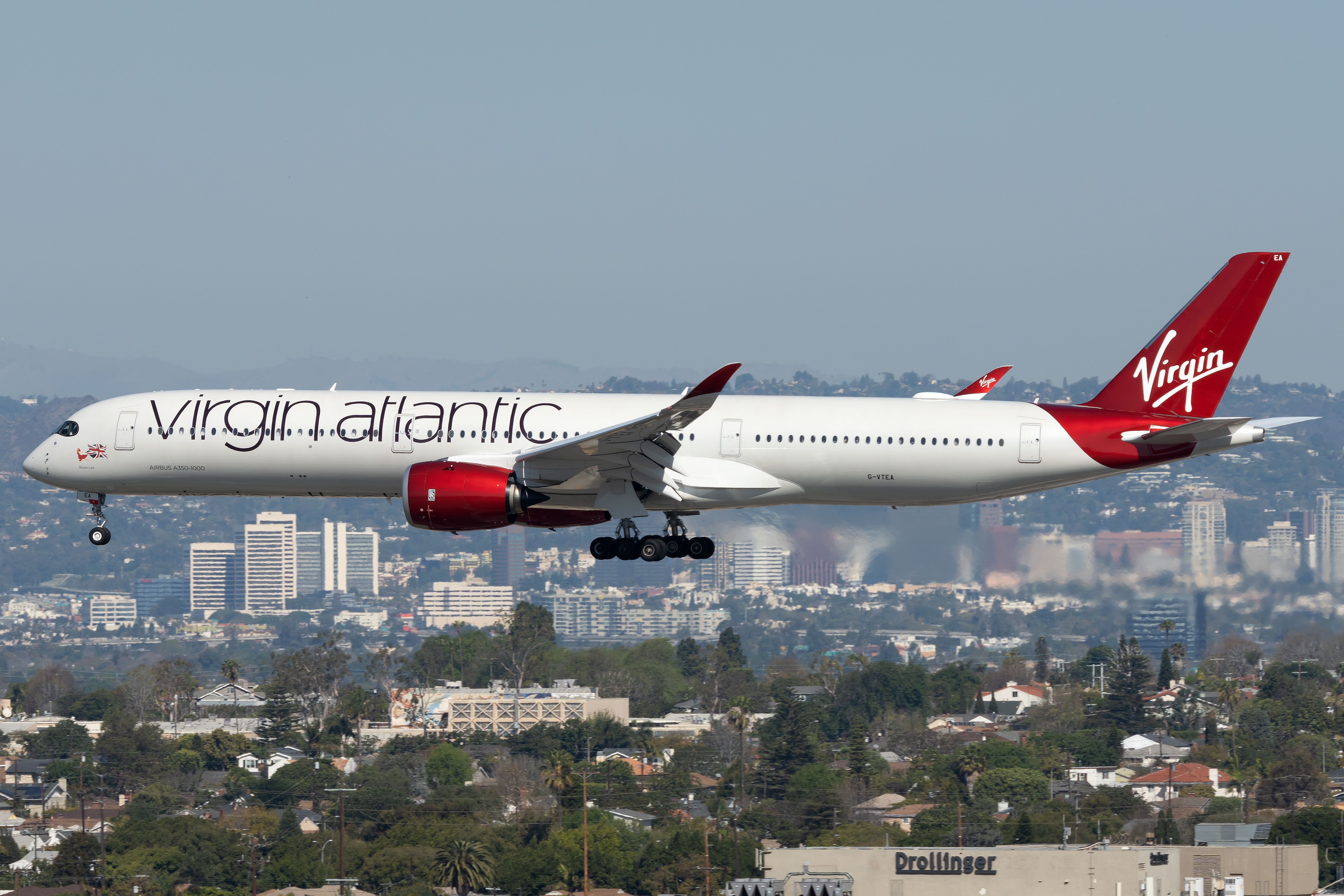 A Virgin Atlantic Airbus aircraft flies over the city of Los Angeles
