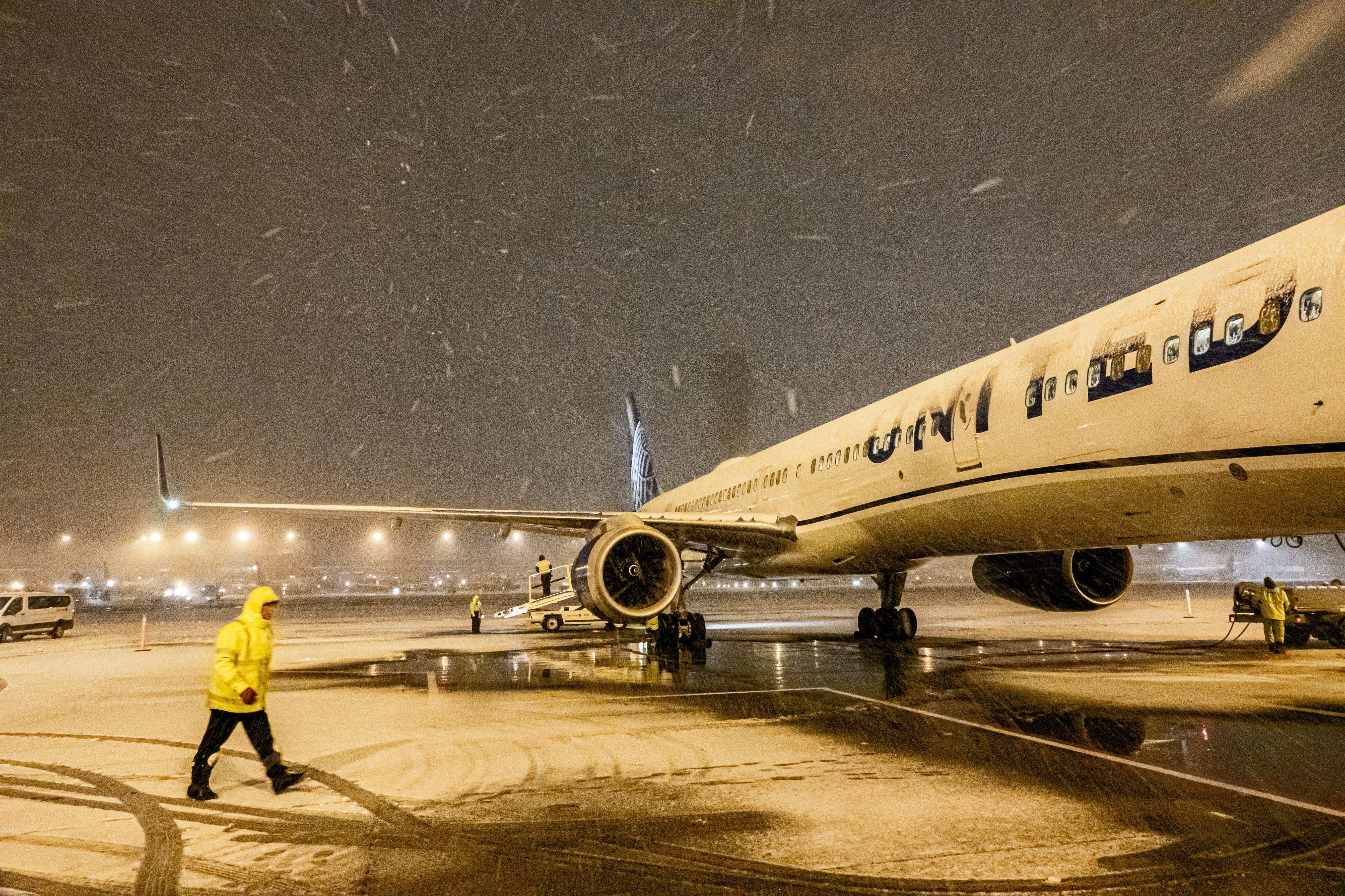 United Airlines Boeing 757 in snow at airport