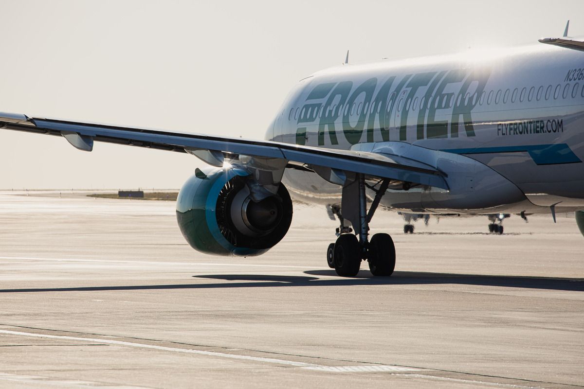 A Frontier Airlines plane taxis at Denver Airport