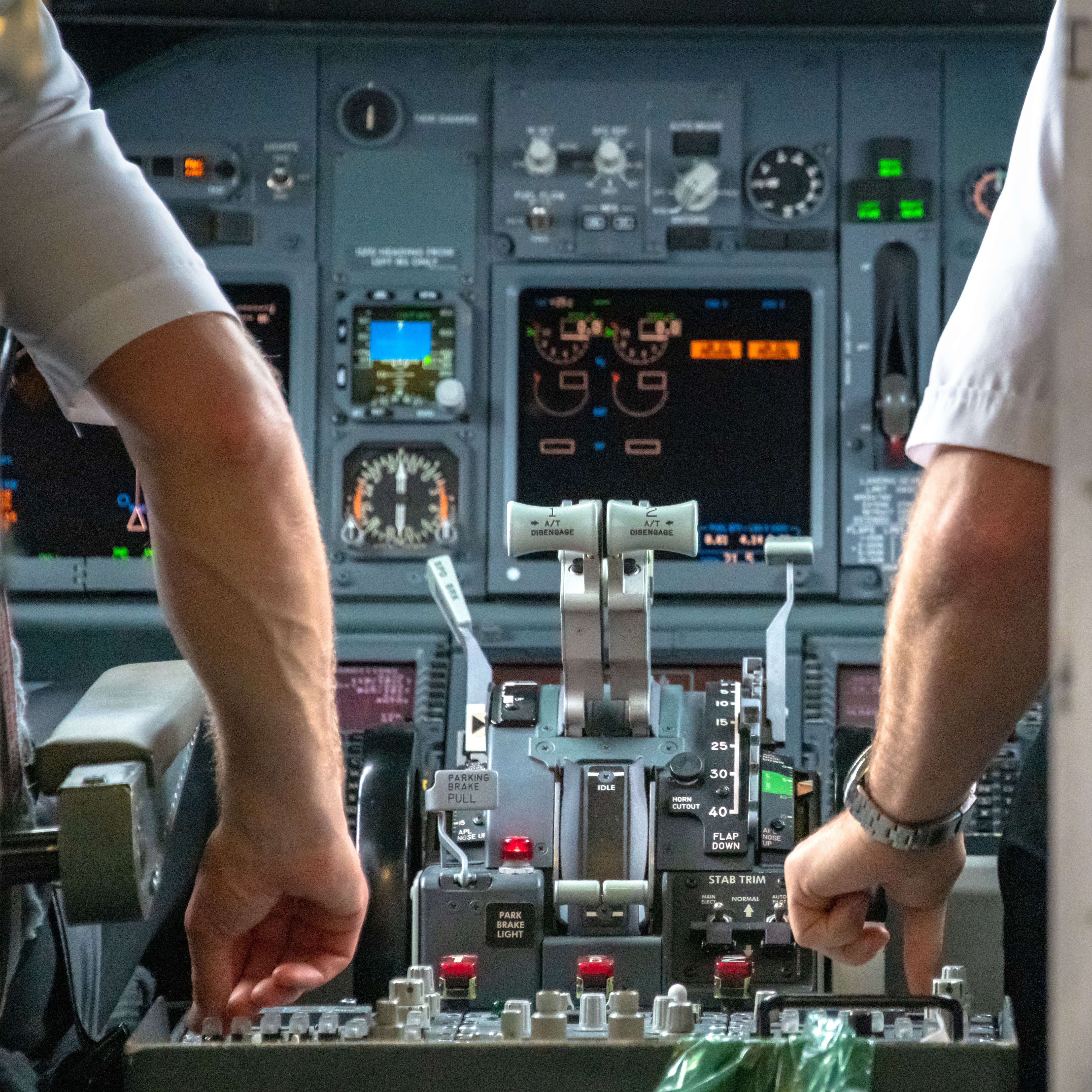Pilot controls inside airplane cockpit