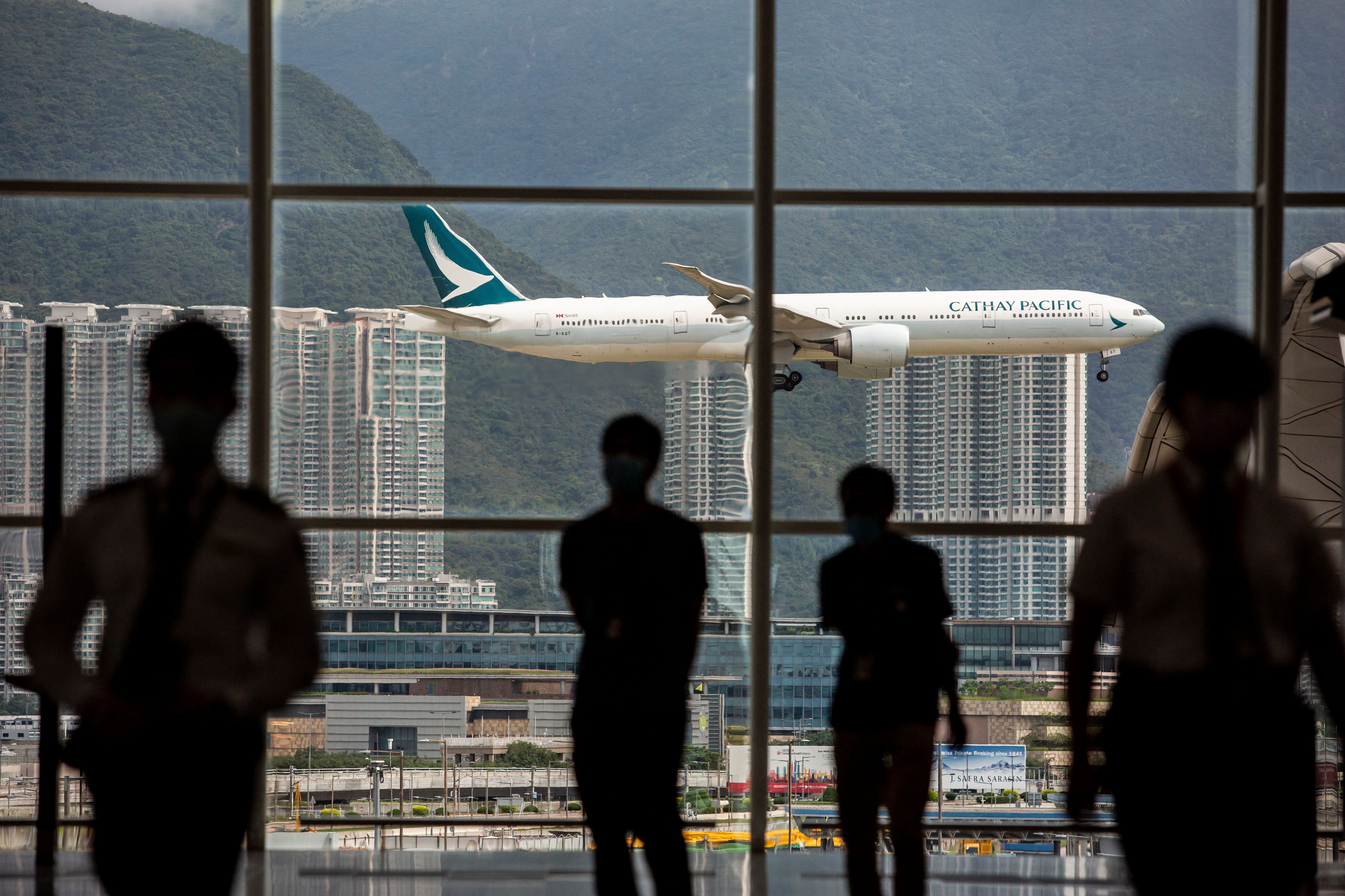 A Cathay Pacific aircraft comes in to land at Hong Kong International Airport on August 11, 2021.