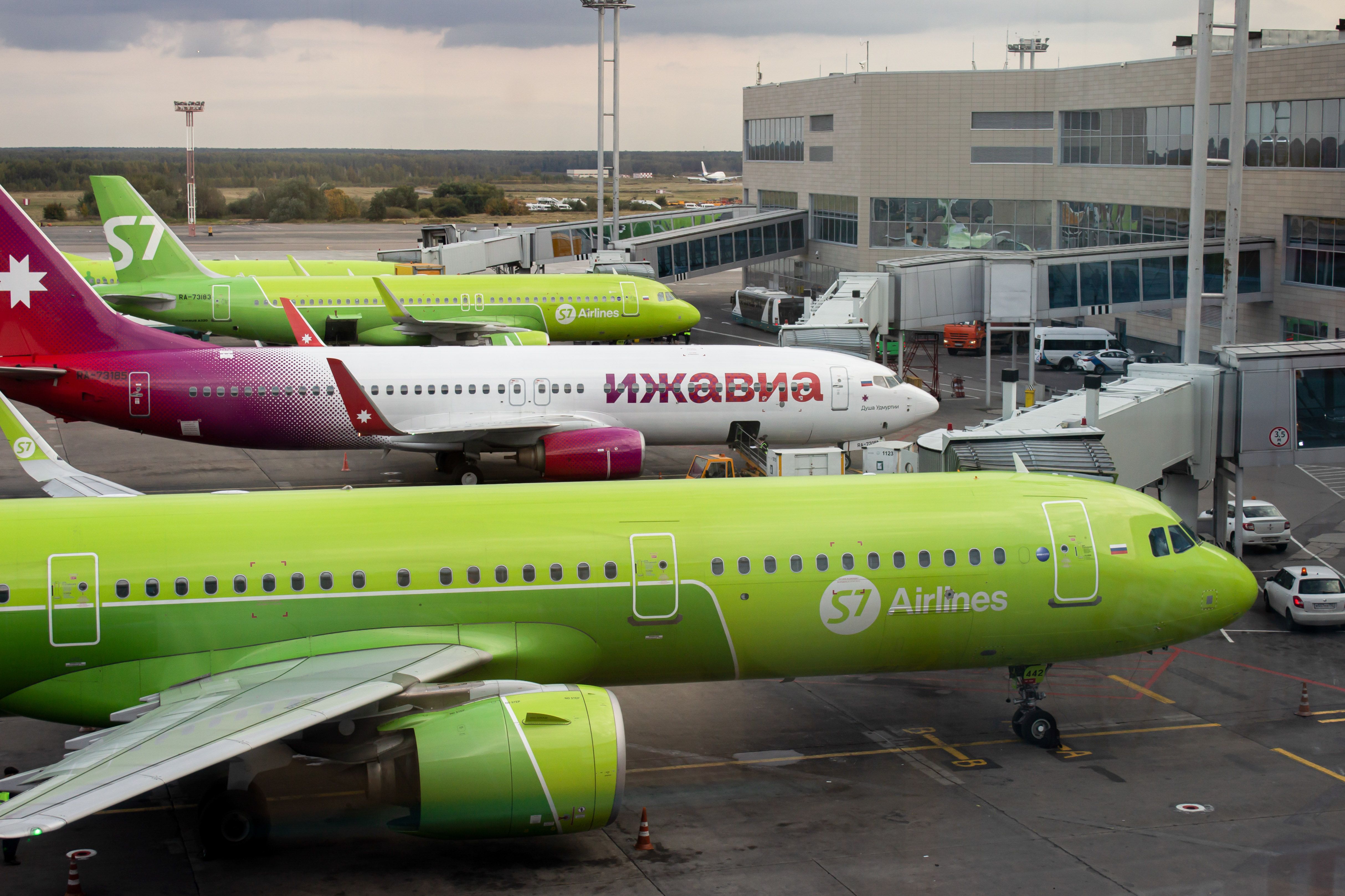 Aircraft from S7 Airlines and Izhavia Airlines are seen at the Domodedovo airport in Moscow.