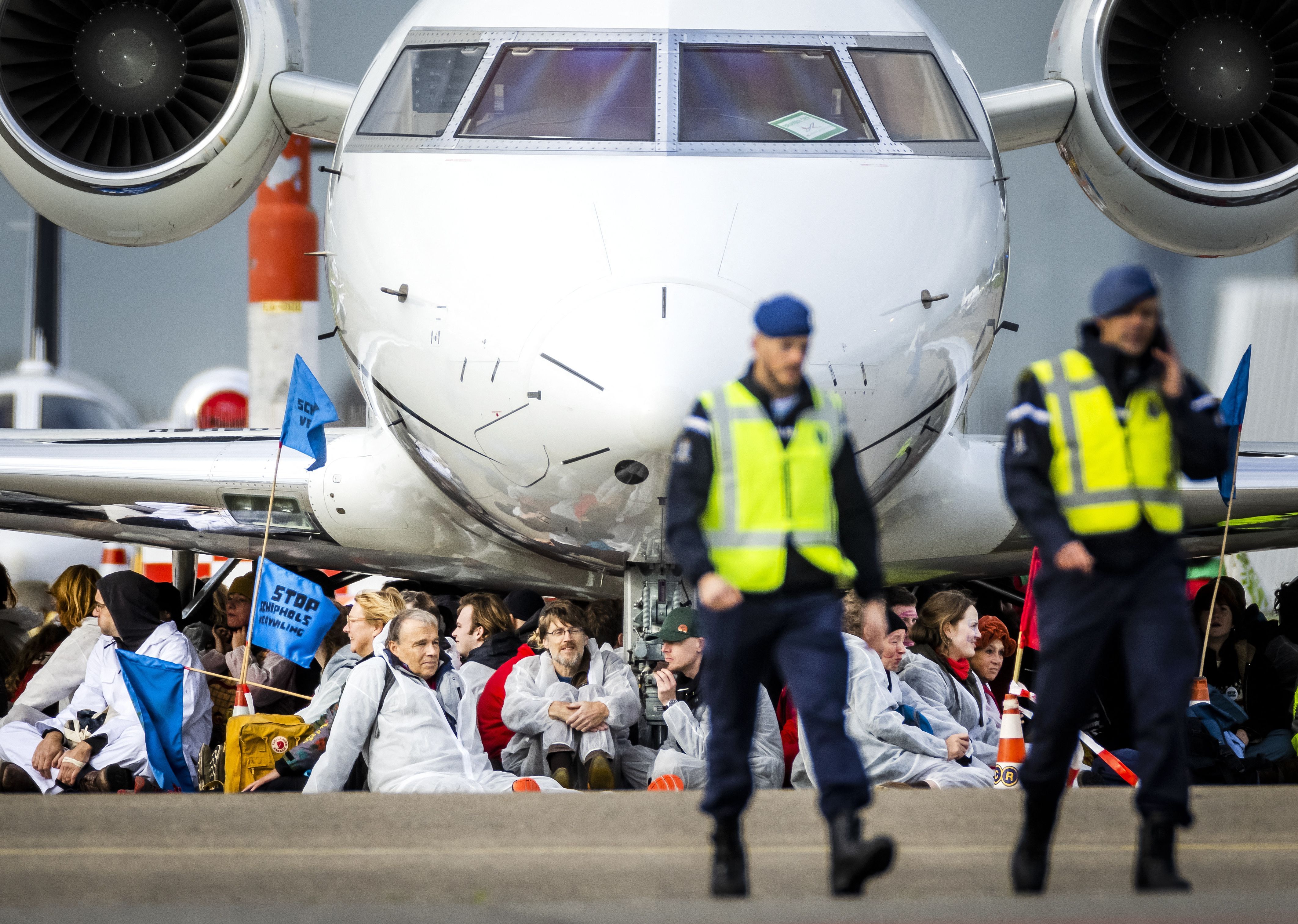 Amsterdam Protesters at the wheels of a private jet