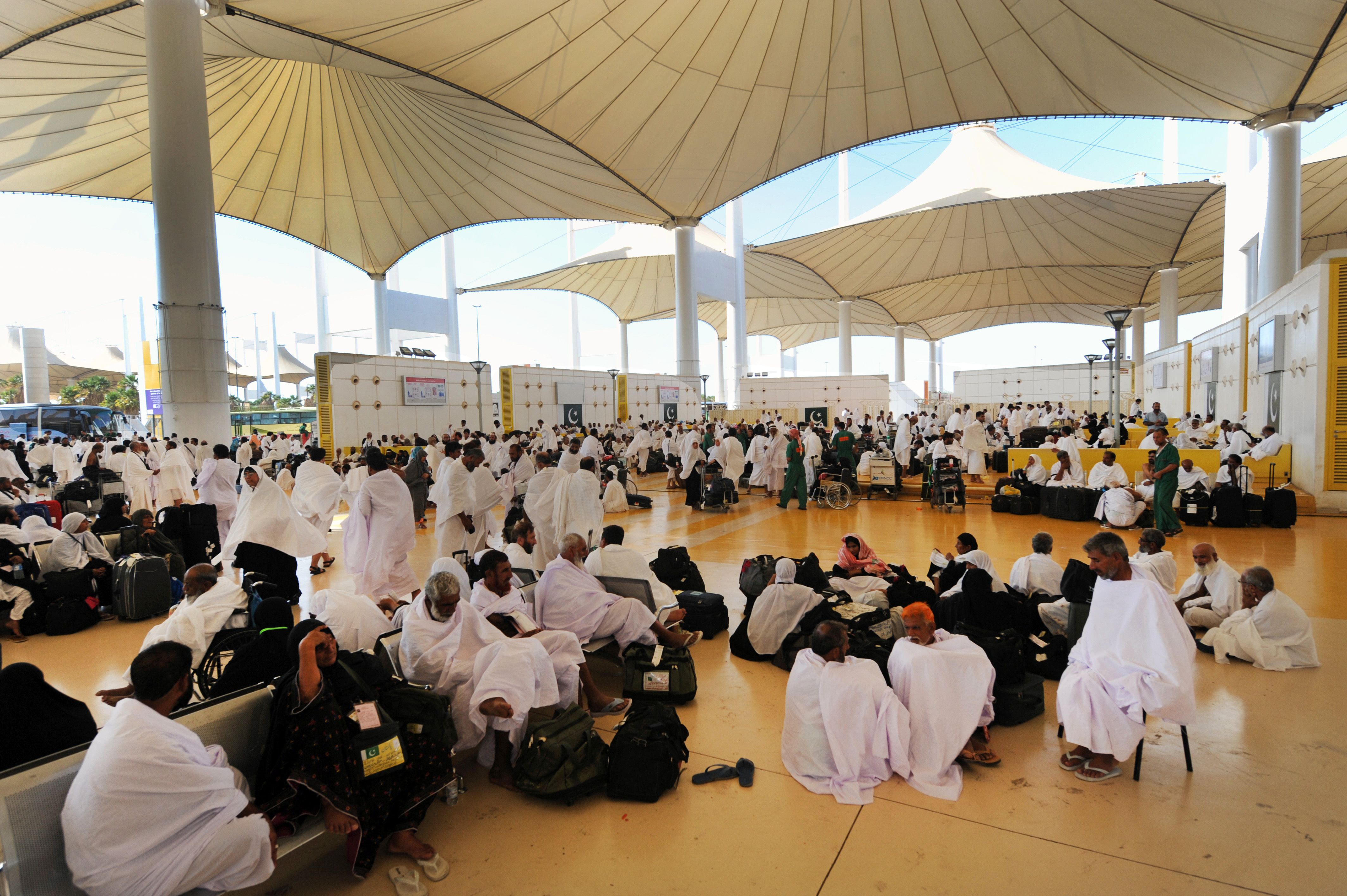 passengers at Jeddah terminal wait to be transferred to Mecca for Hajj