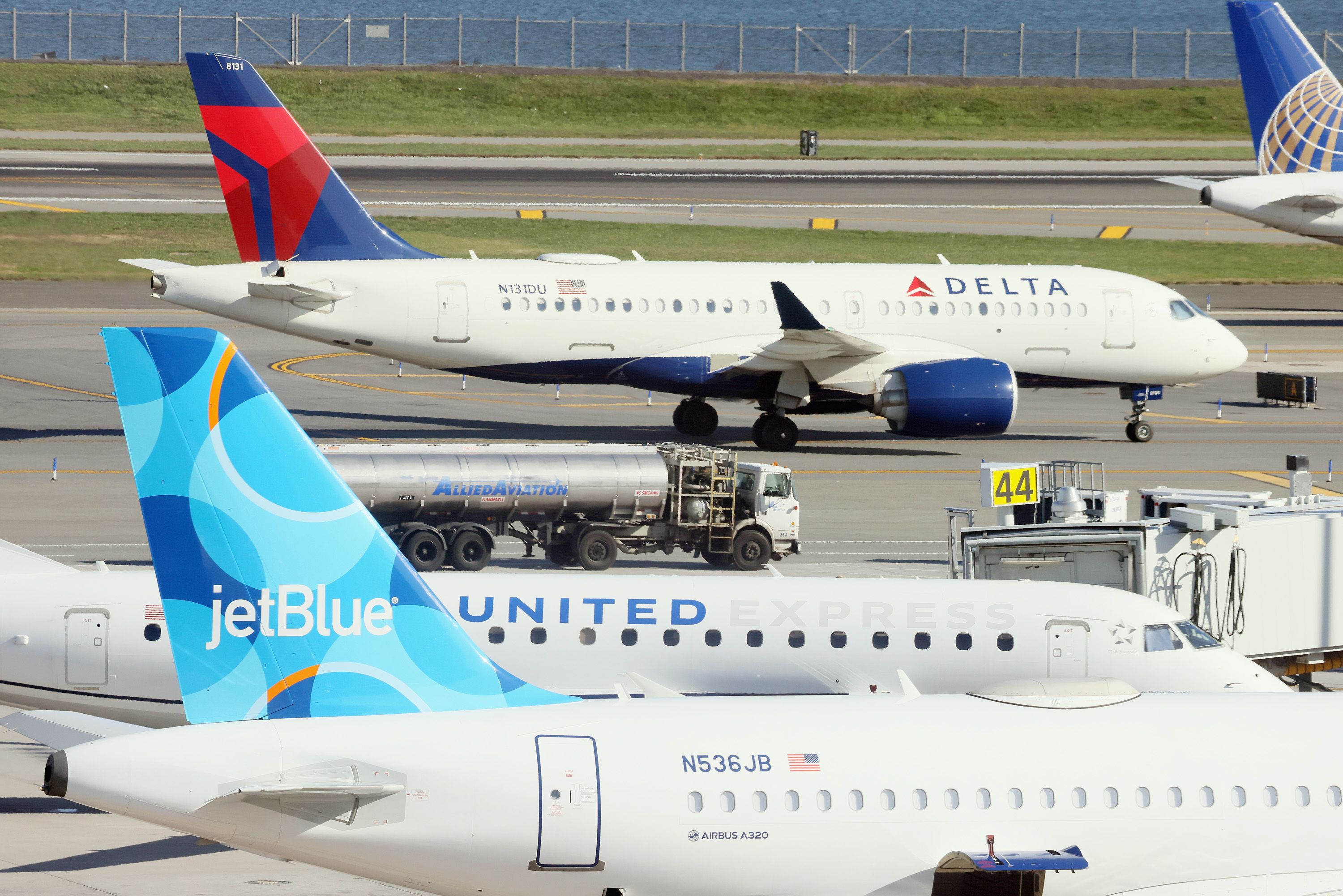 Delta, JetBlue, United airlines planes at airport 