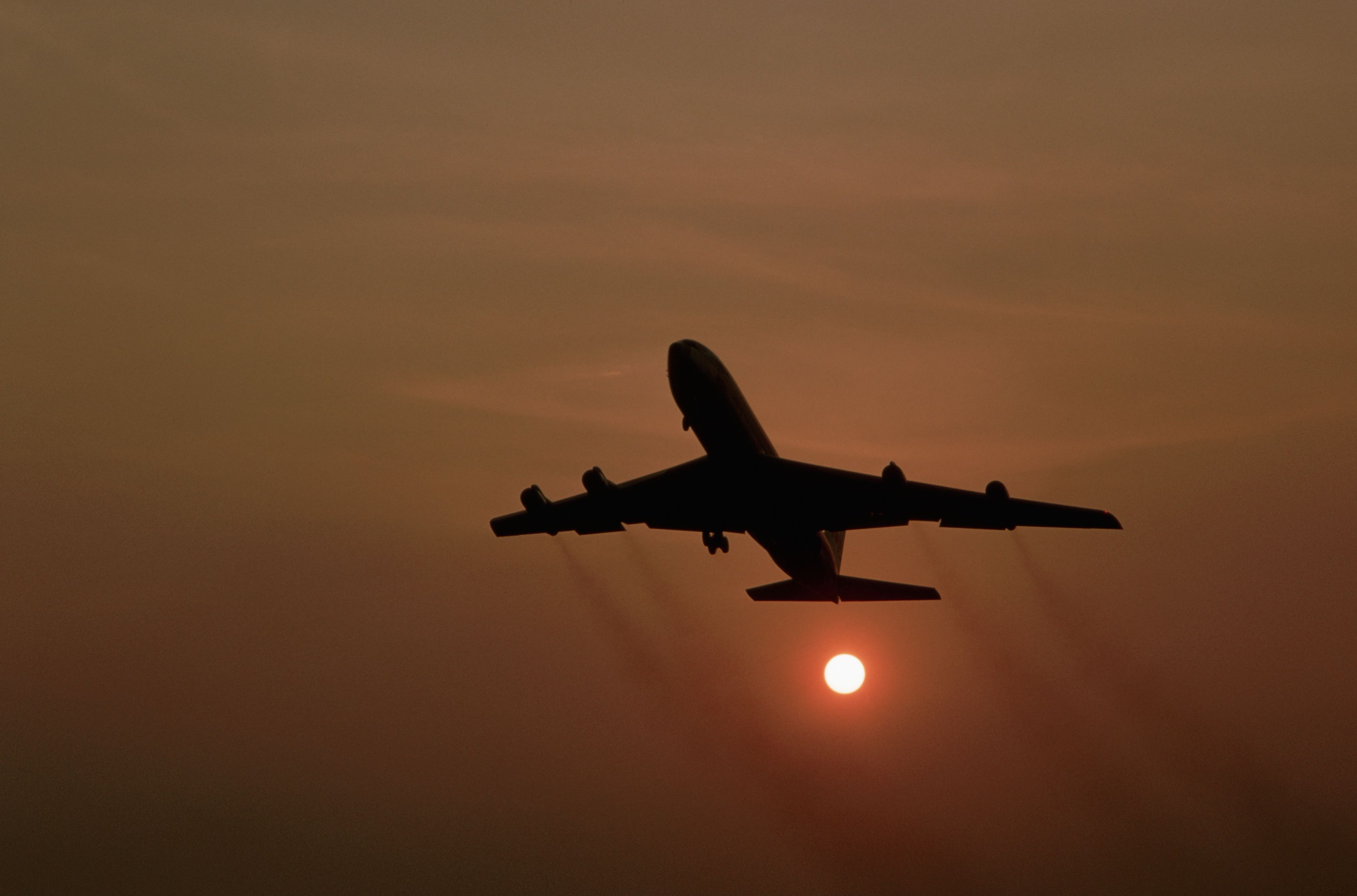 Boeing 707 Taking off at Sunset