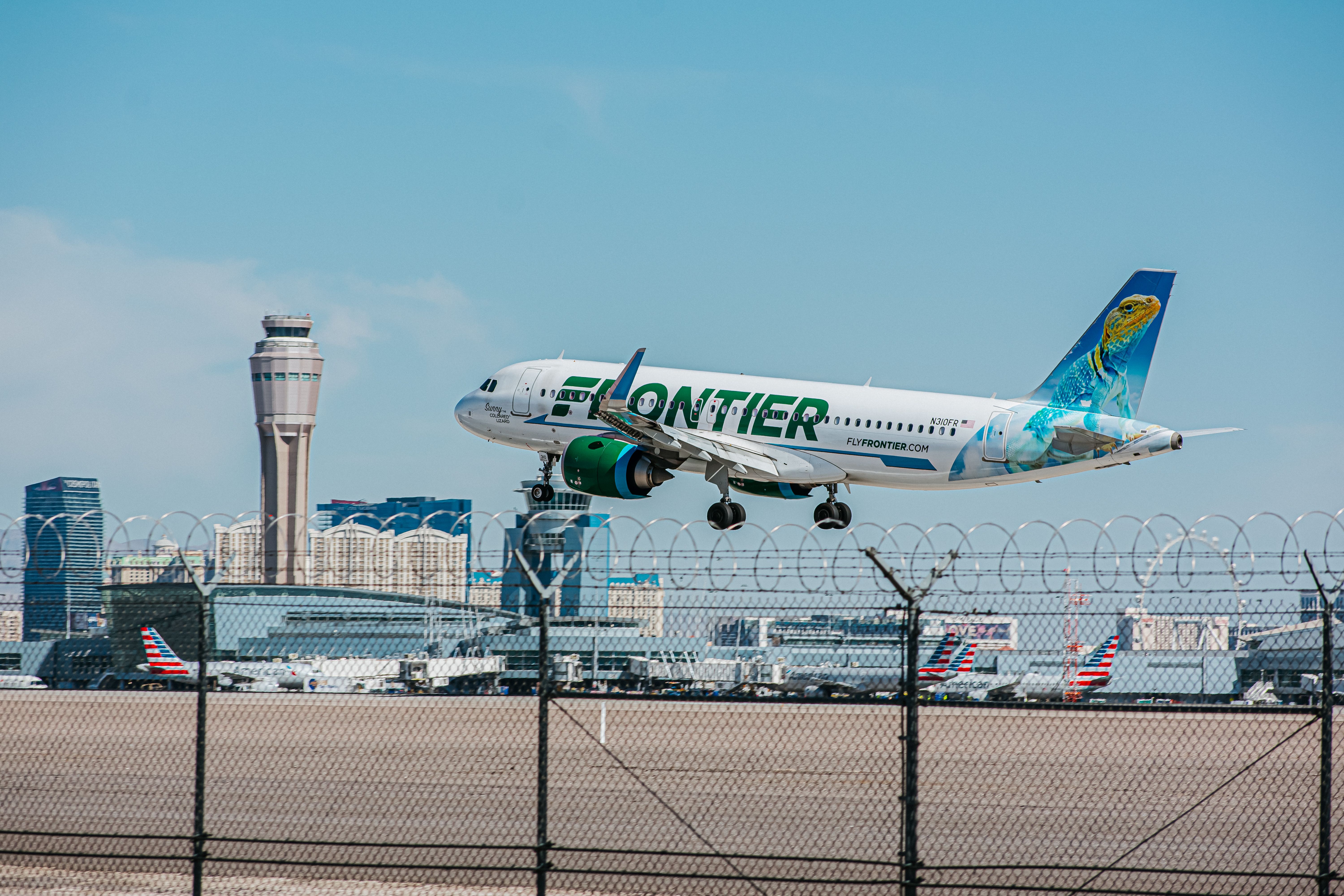 A Frontier Airlines Airbus A320neo landing at LAS.