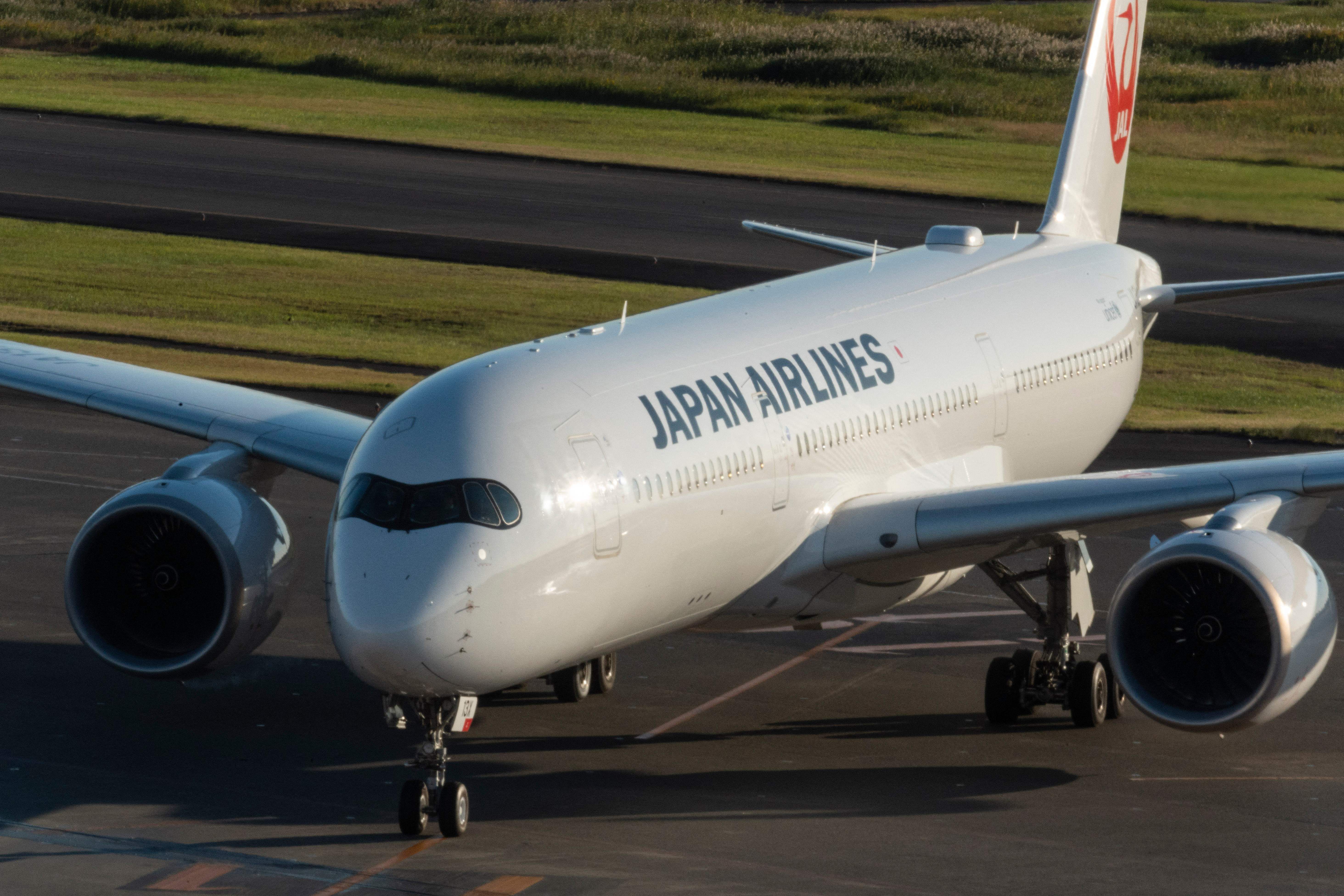 Japan Airlines (JAL) arriving at a gate at Tokyo International Airport at Haneda in Tokyo