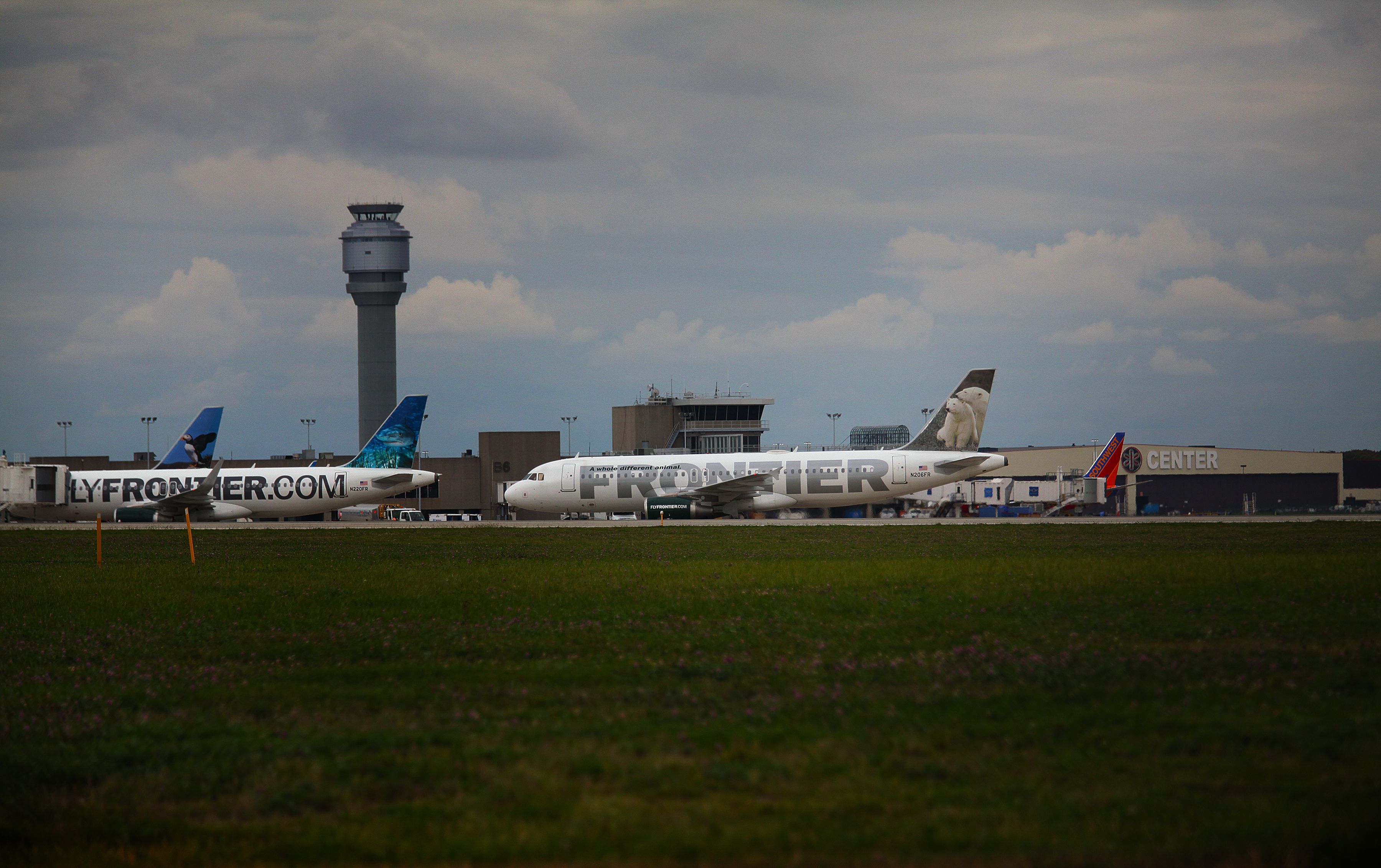 GettyImages-457276660 -  A Frontier Airlines plane taxis the runway at Cleveland Hopkins Airport on October 15, 2014