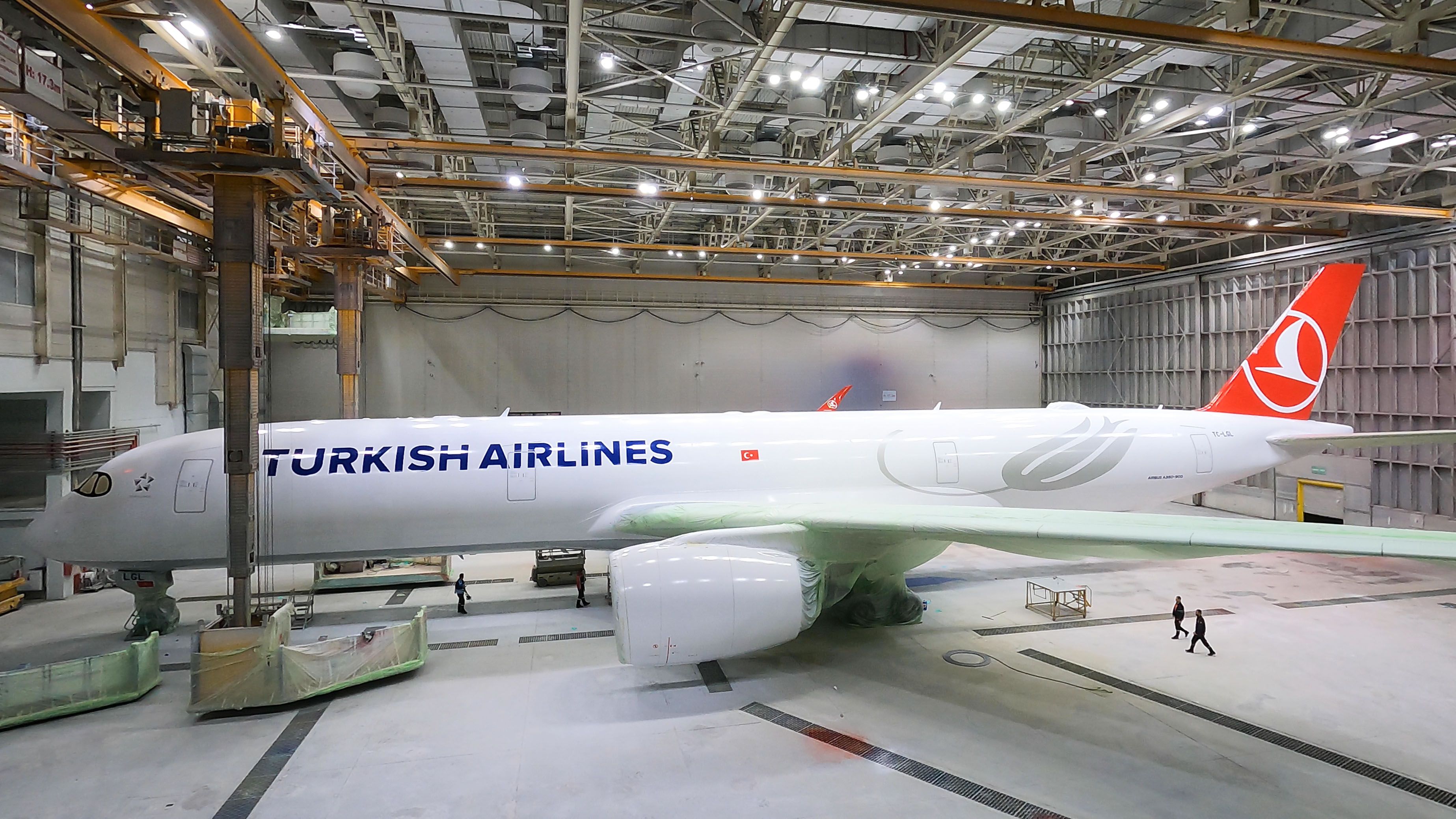 A Half painted Turkish Airlines Airbus A350 inside a warehouse.