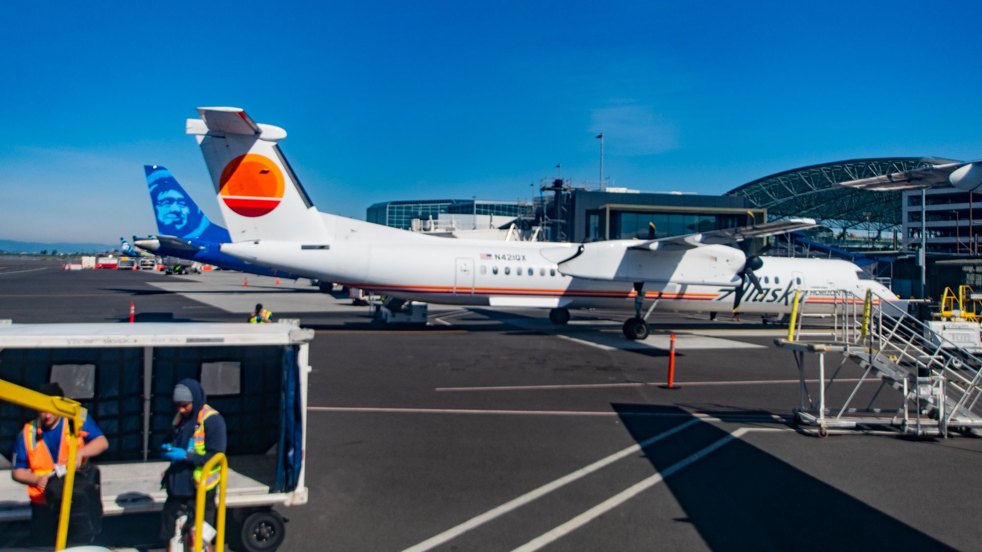 Looking Back at PDX Concourse B With Horizon Q400 and ERJ-175 at Gates