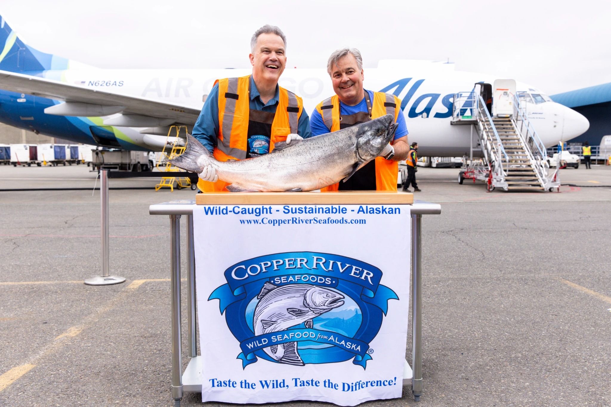 download (1) - Greg McDole and Jim Kostko, Copper River Seafoods. in front of a 737 Freighter