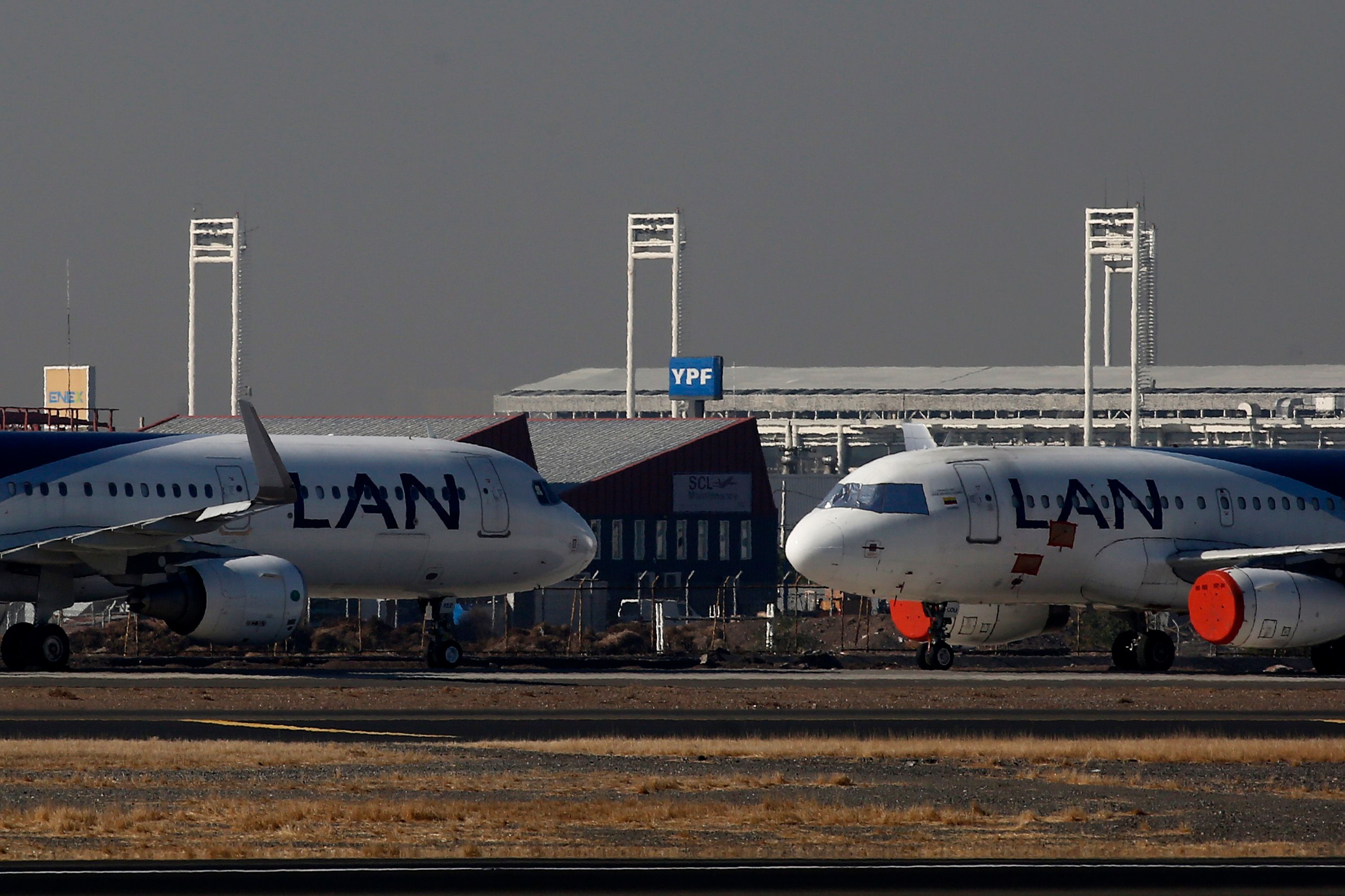 GettyImages-1215219967 - Passenger planes of LATAM airline stand parked at Arturo Merino Benitez International Airport on May 26, 2020 in Santiago, Chile.