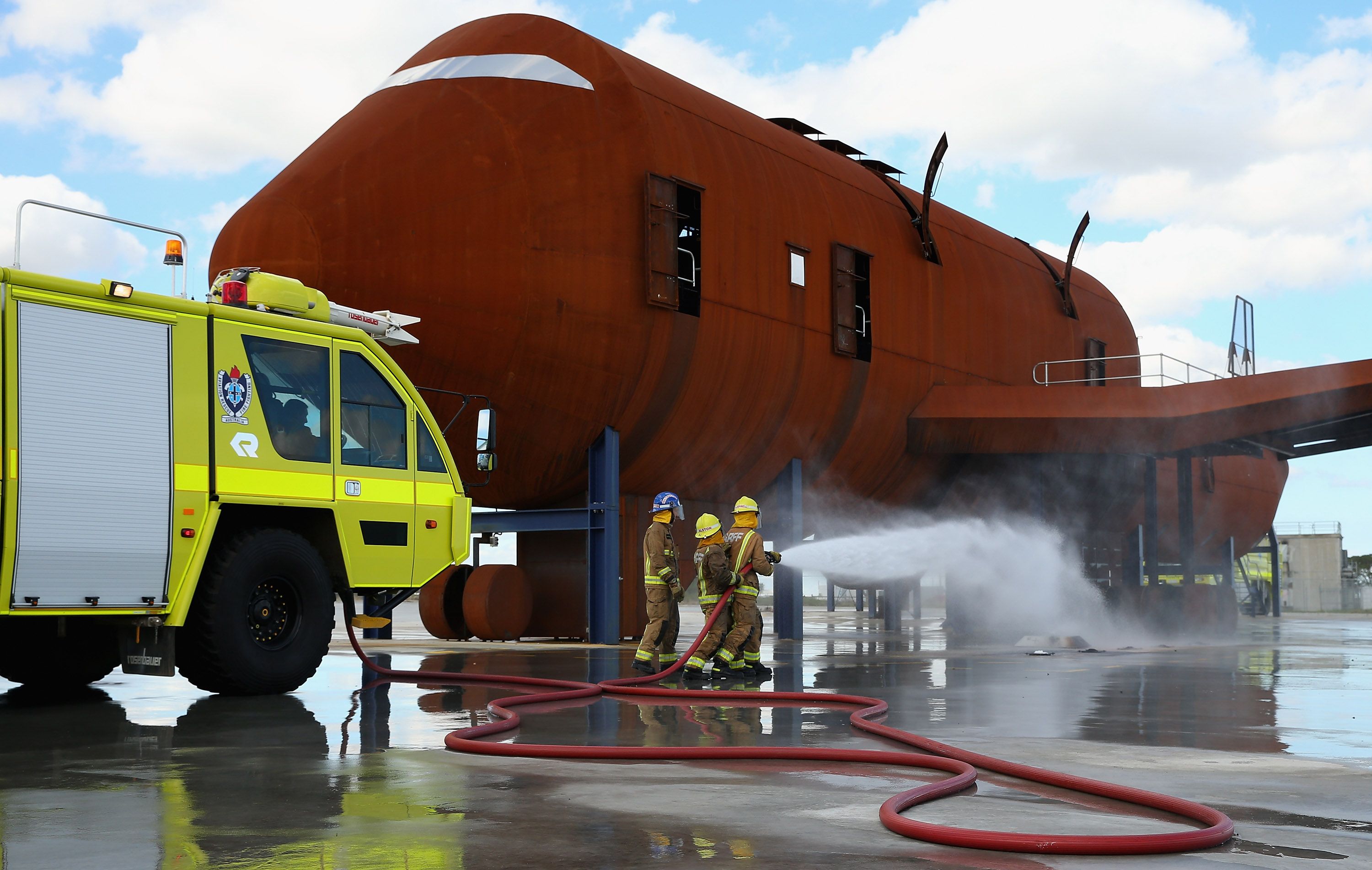 Fire fighters put on a demonstration at the Opening of Airservices Hot Fire Training Ground in Melbourne