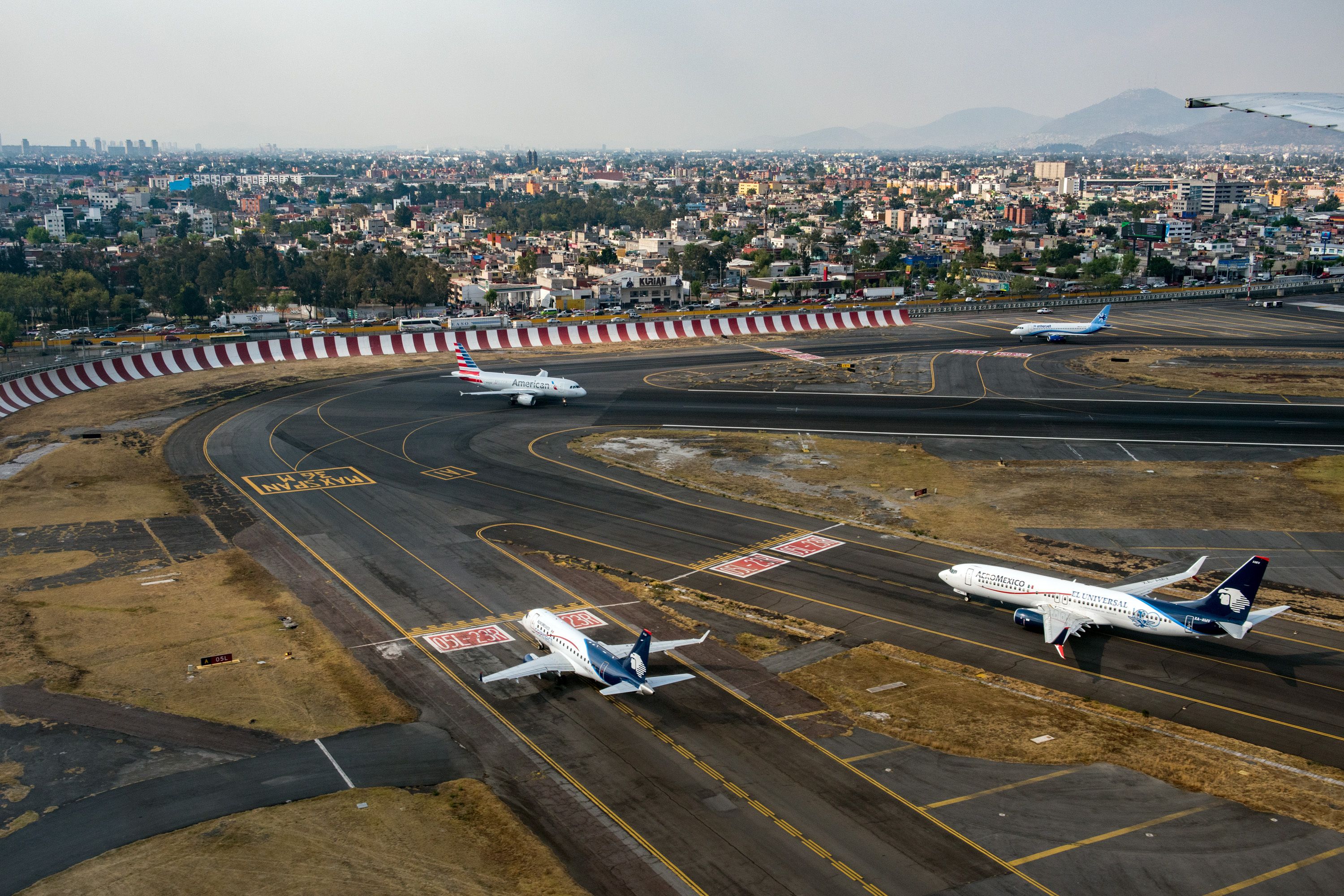 Several aircraft lined up to depart from Mexico City