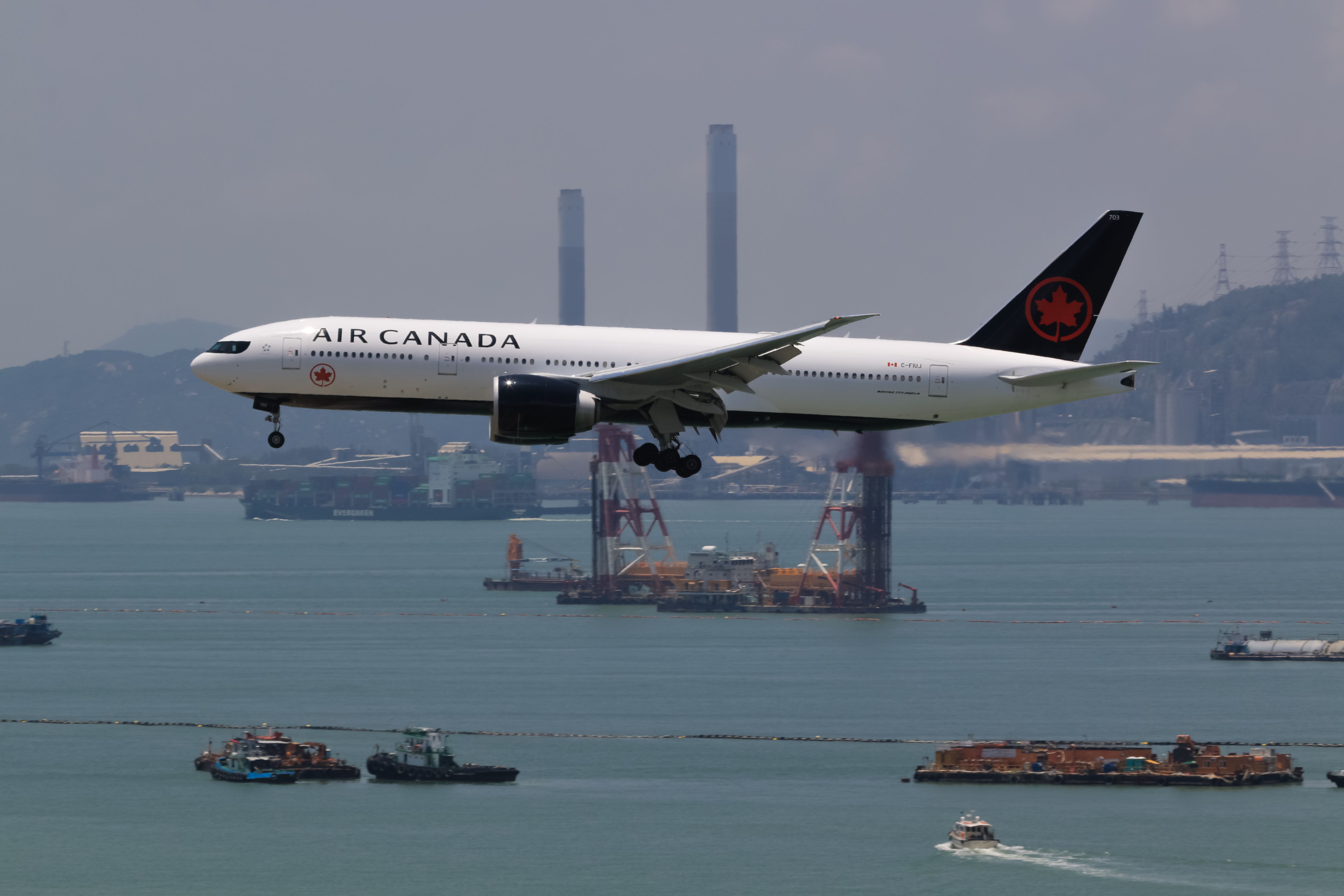 shutterstock_1235818396 - Hong Kong, China. June 28, 2018. Air Canada Boeing 777-200 Reg. C-FIUJ on Short Final Approaching for Landing at Hong Kong Chek Lap Kok International Airport.