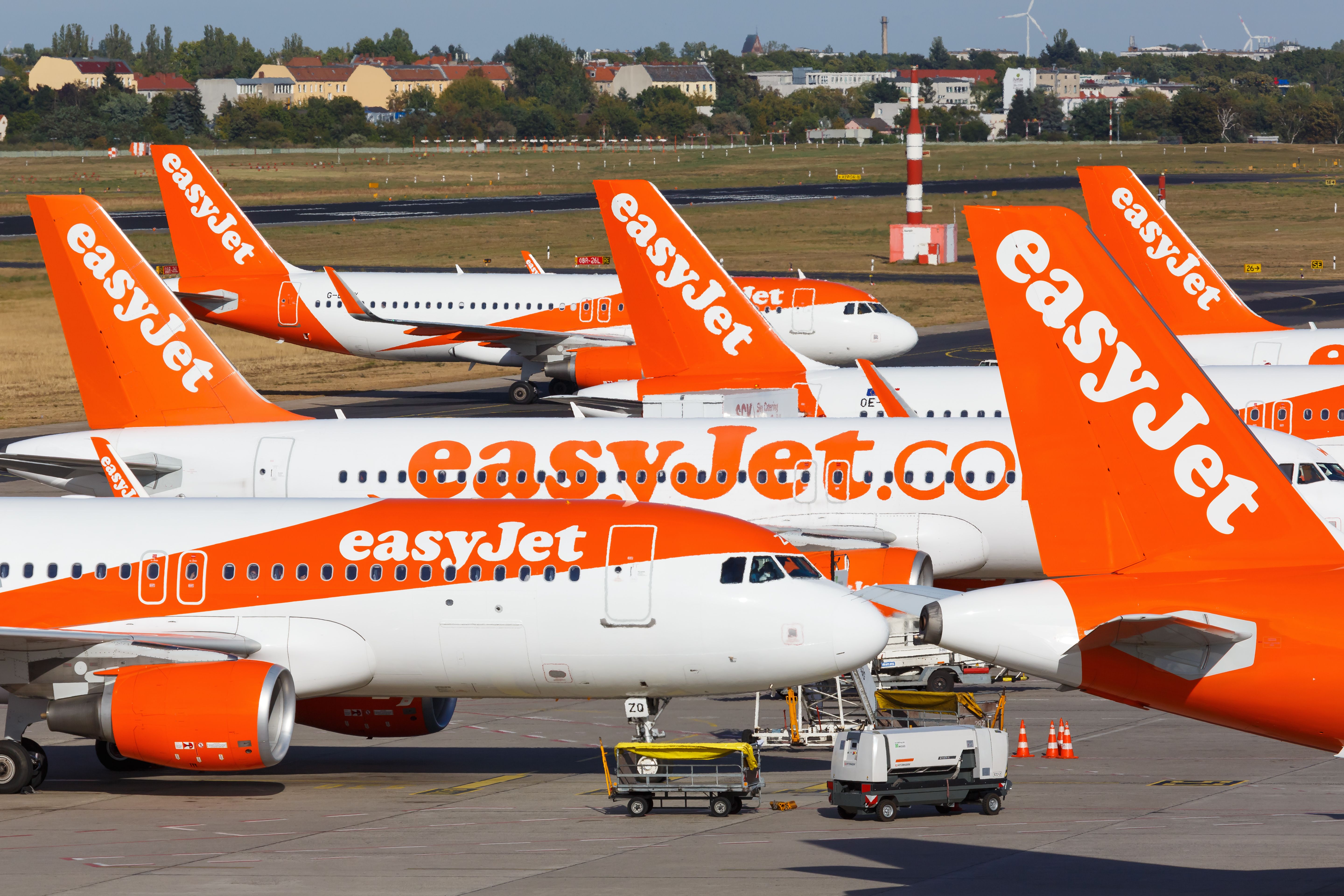 A large fleet of easyJet aircraft on the apron at Berlin Tegel Airport.