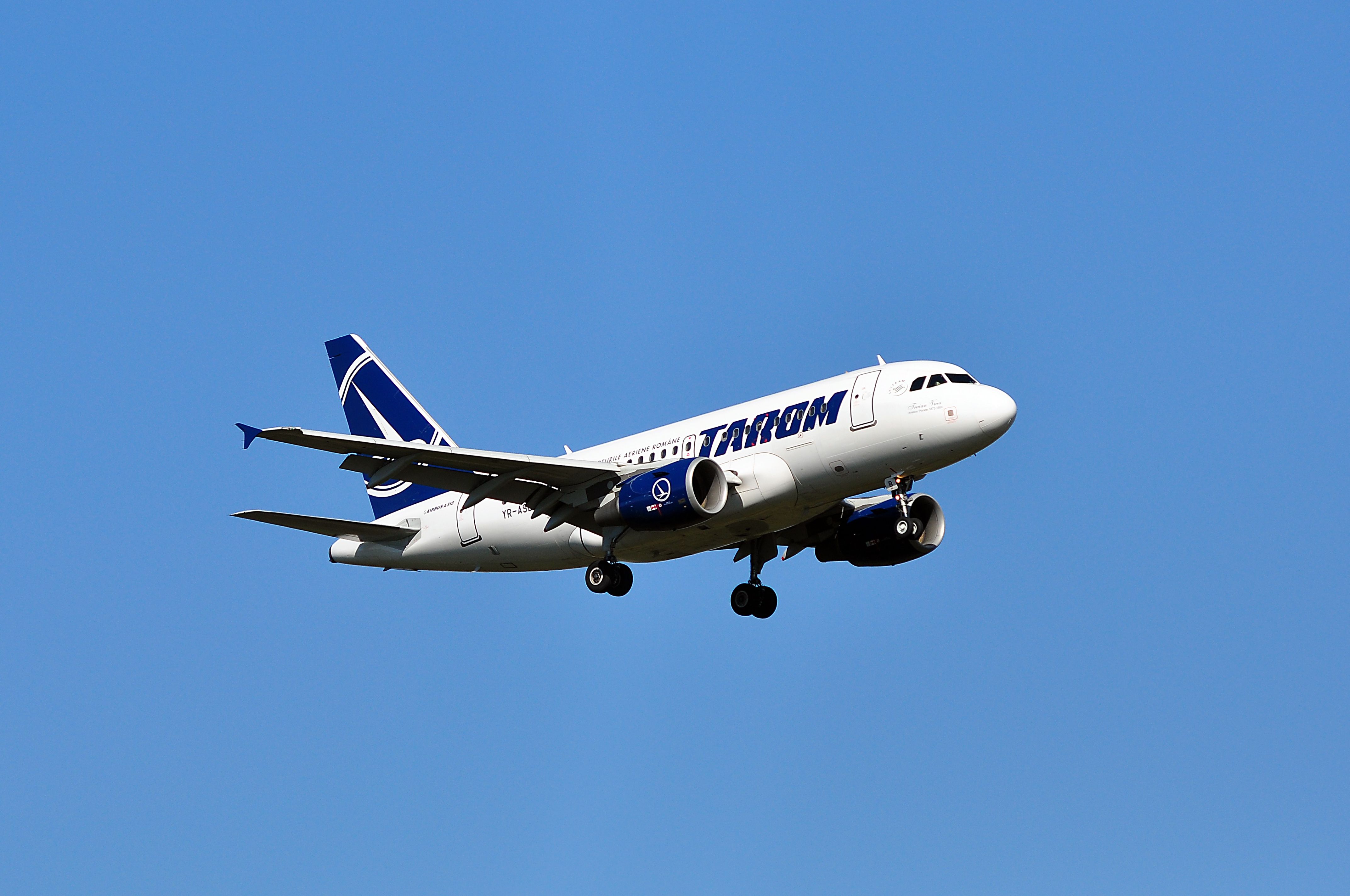 A TAROM Airbus A318 flying in the sky.