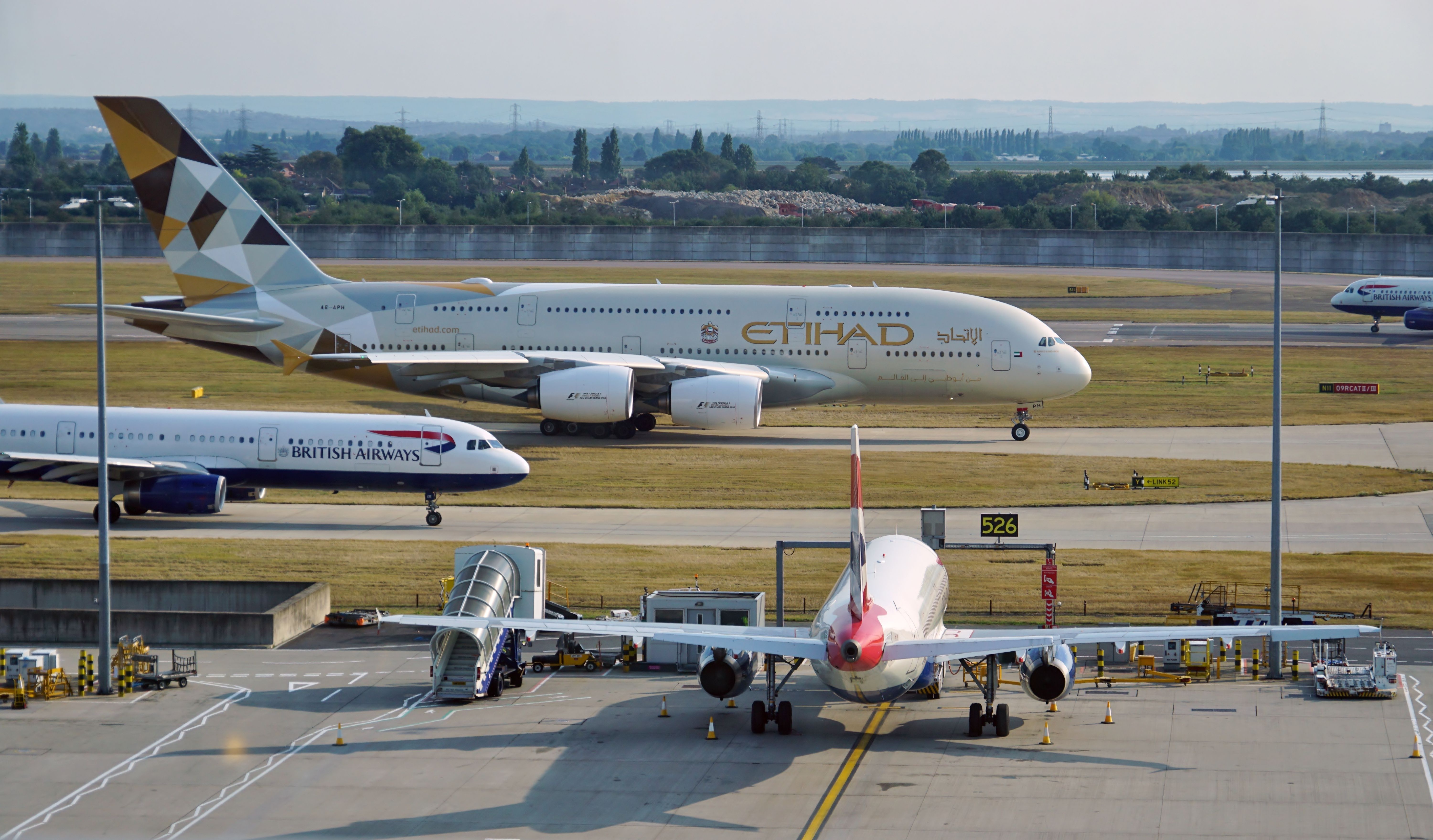 An Etihad Airbus A380 in and British Airways