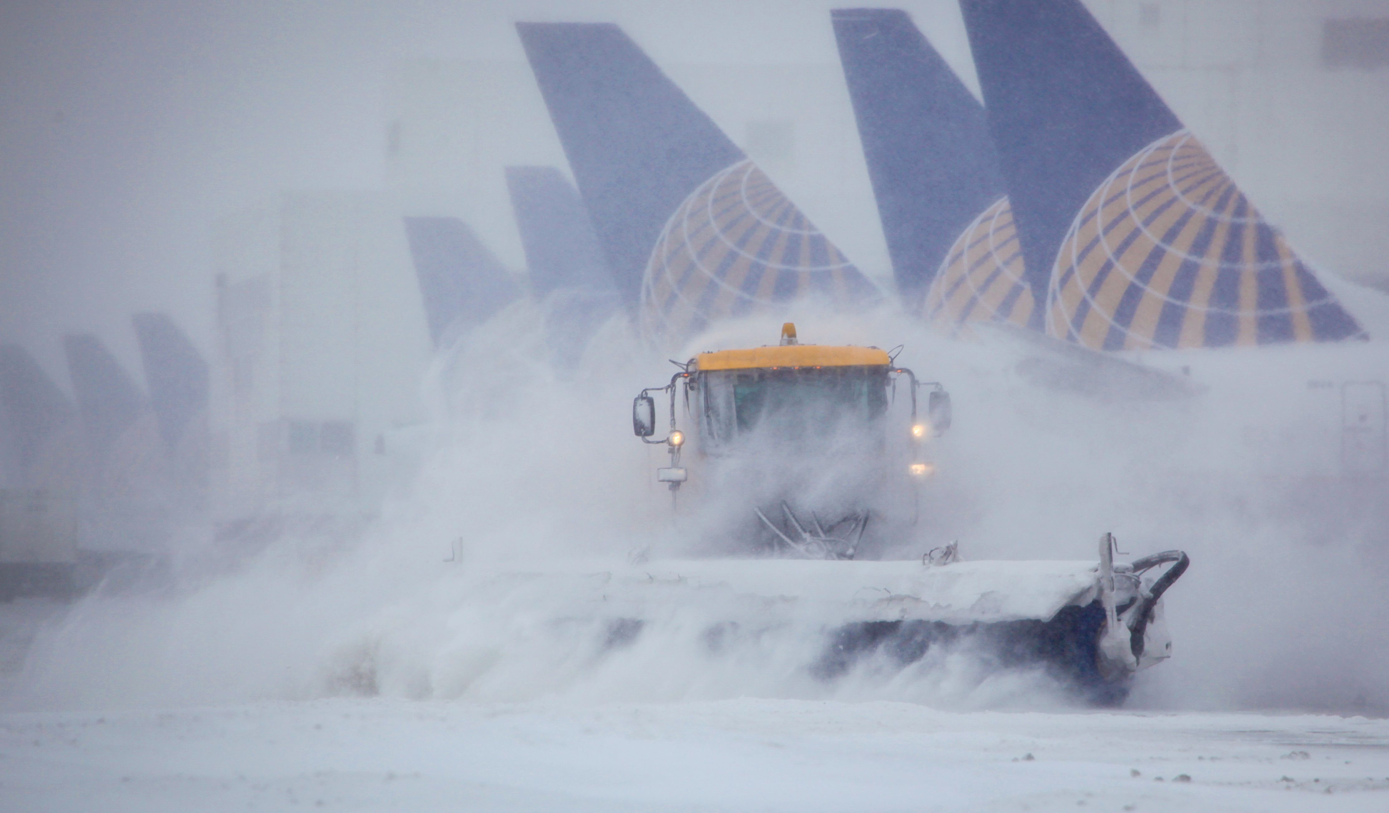Snowplow and United aircraft PC Denver Airport