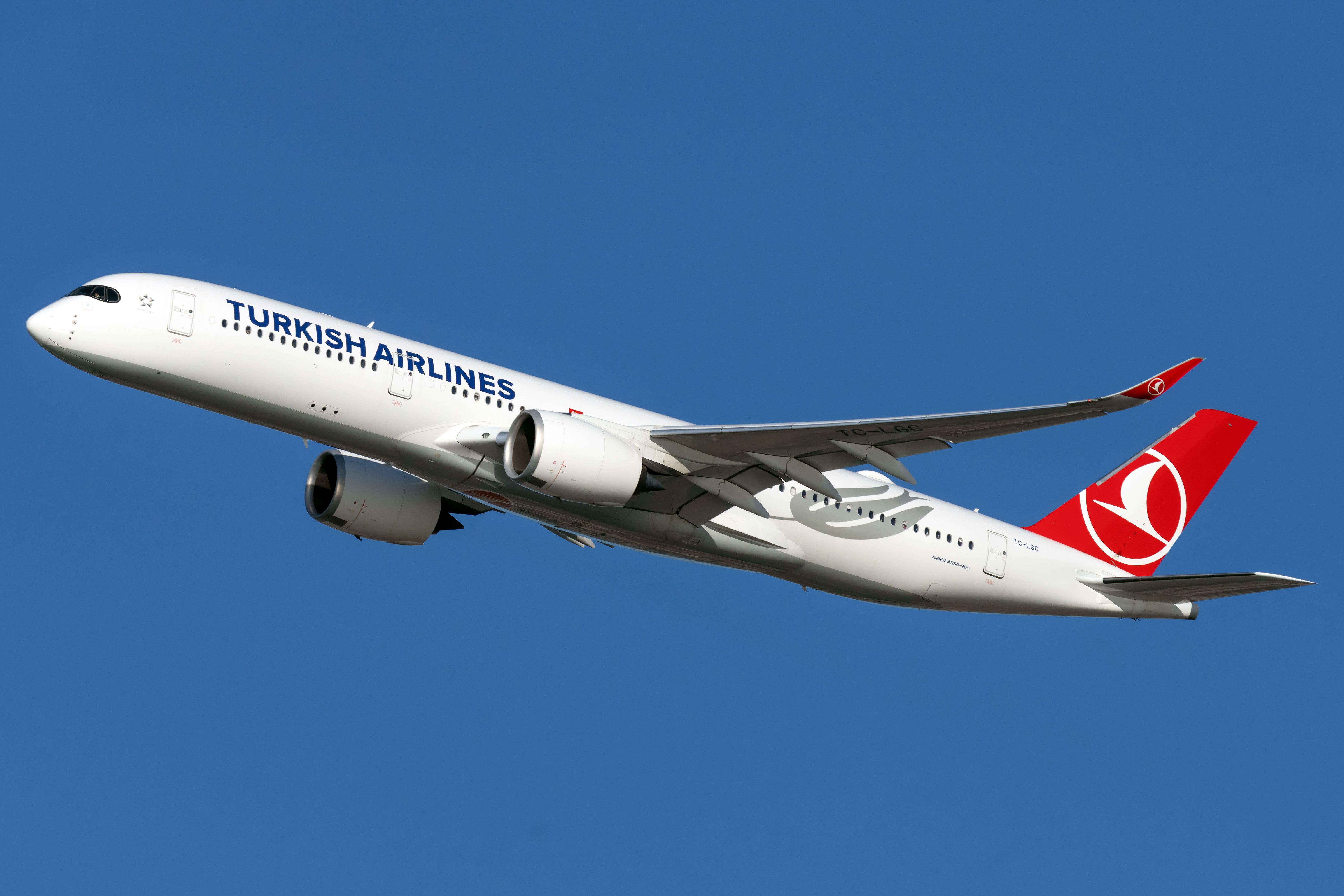 A Turkish Airlines Airbus A350-941, registration TC-LGC, flying in the sky.