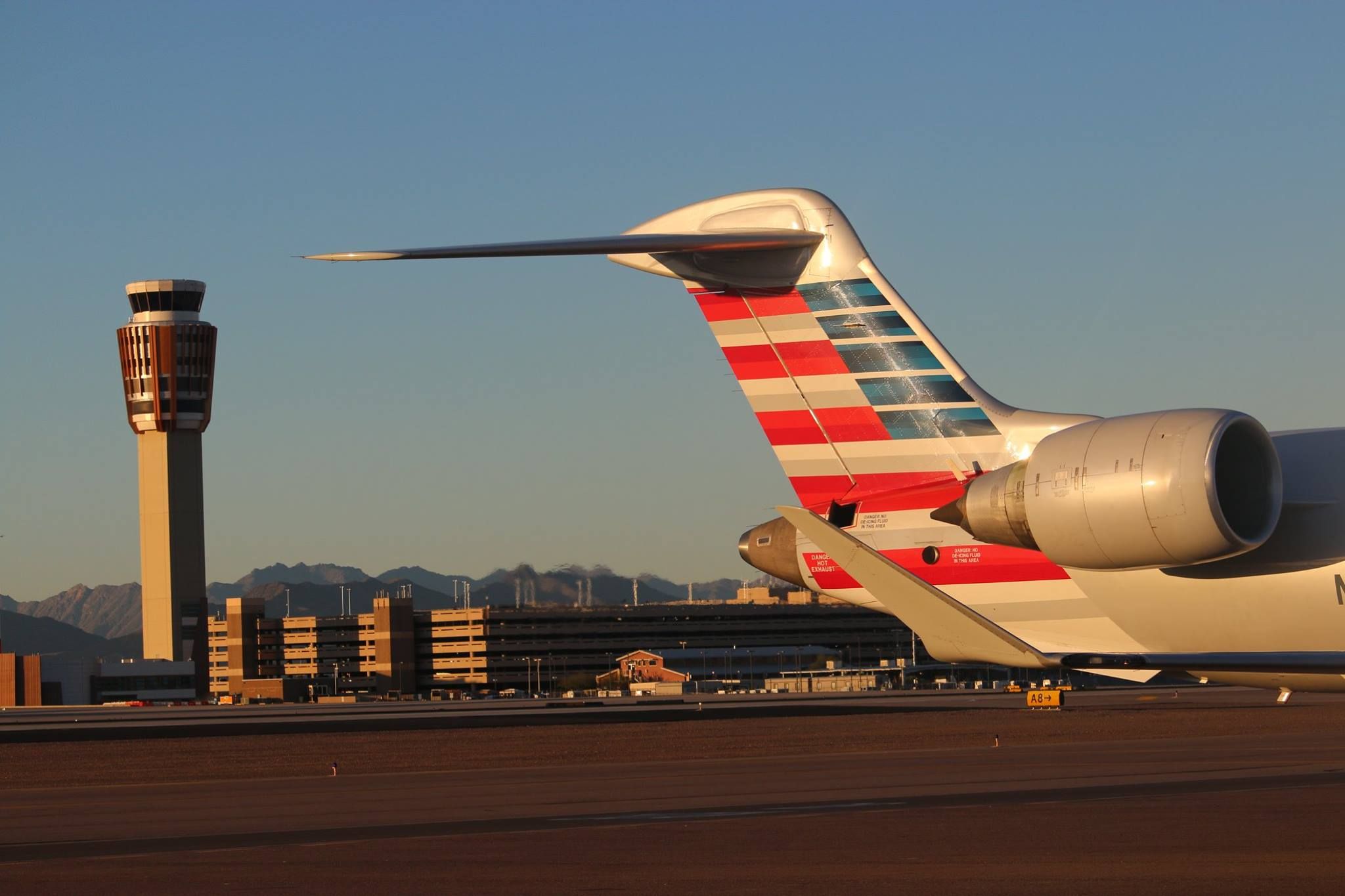 Tail of an American Eagle (operated by Mesa Airlines) CRJ-900 at Phoenix Sky Harbor International Airport