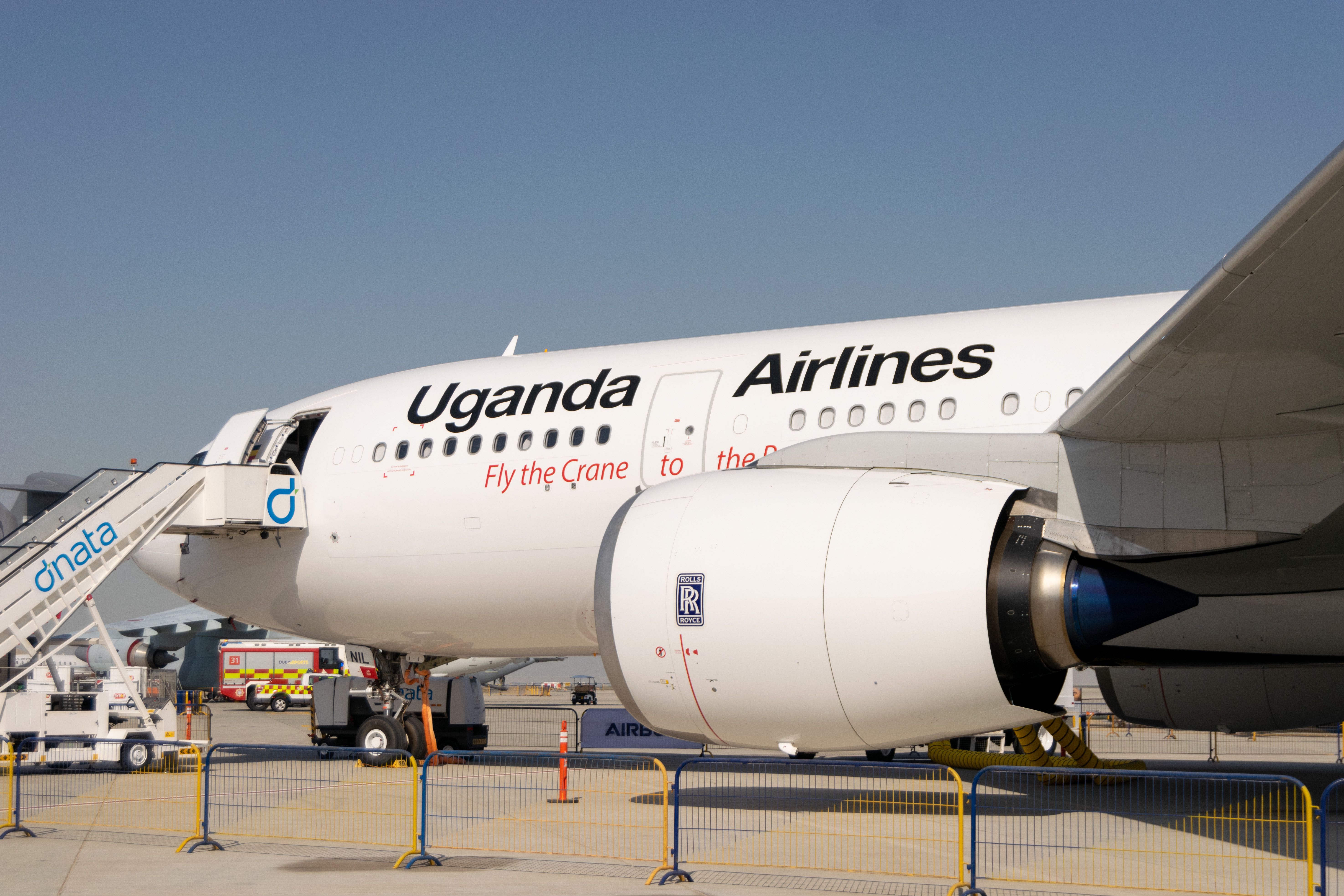 A Uganda Airlines aircraft parked at the airport.