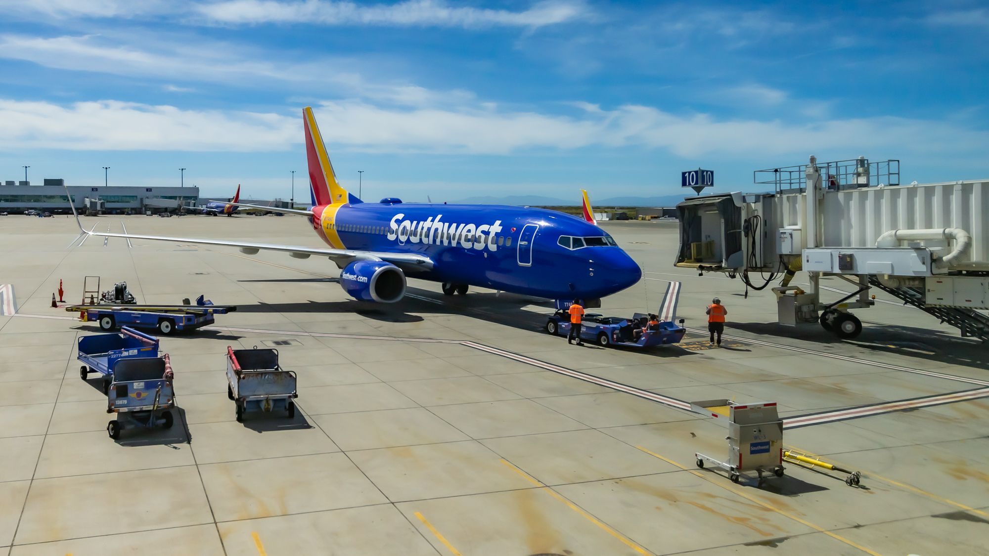 Southwest Airlines Boeing 737-7BD pushing back from Gate 10 at Oakland International Airport.