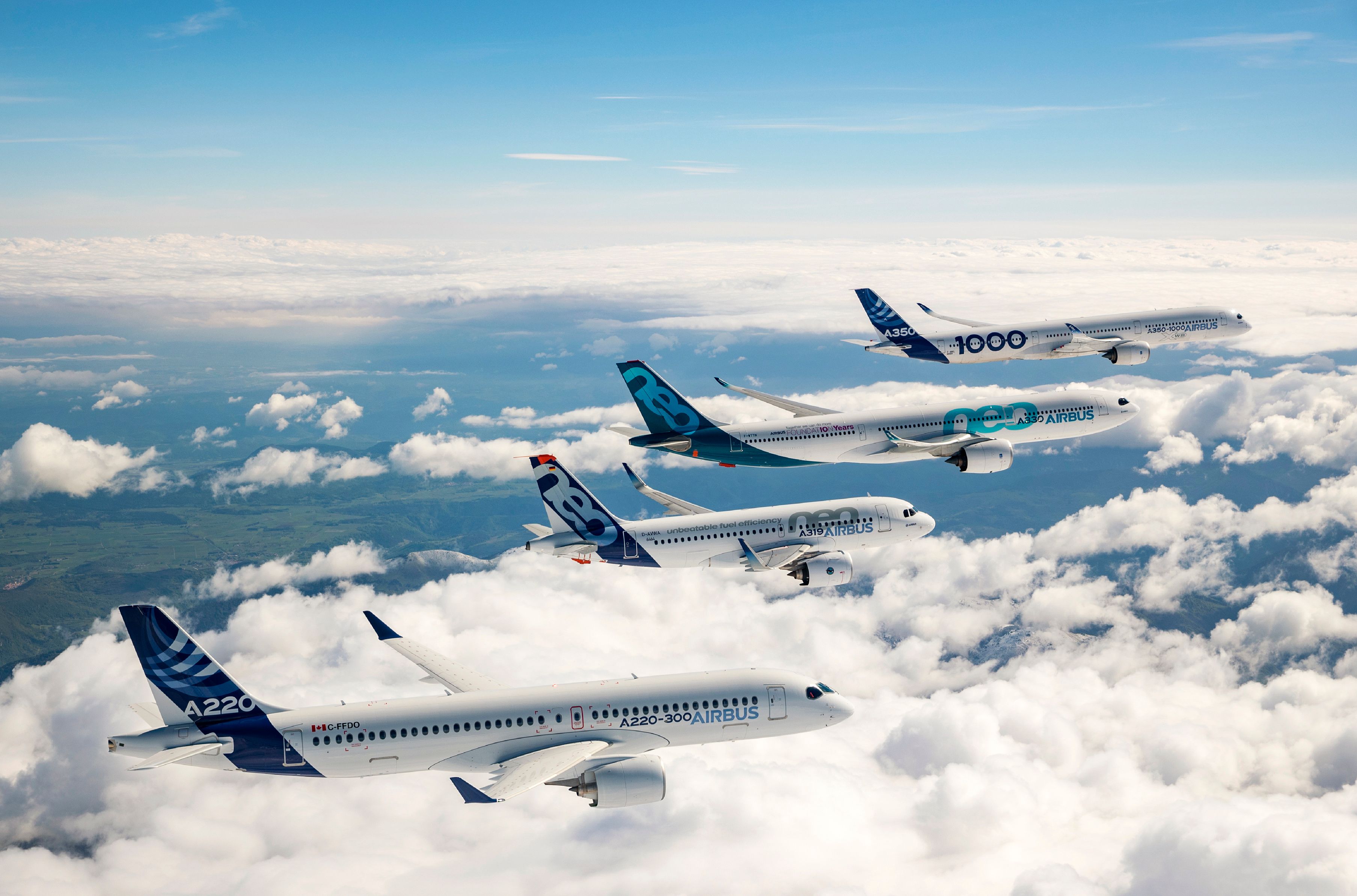 An Airbus A220-300, A319neo, A330neo, and A350-1000