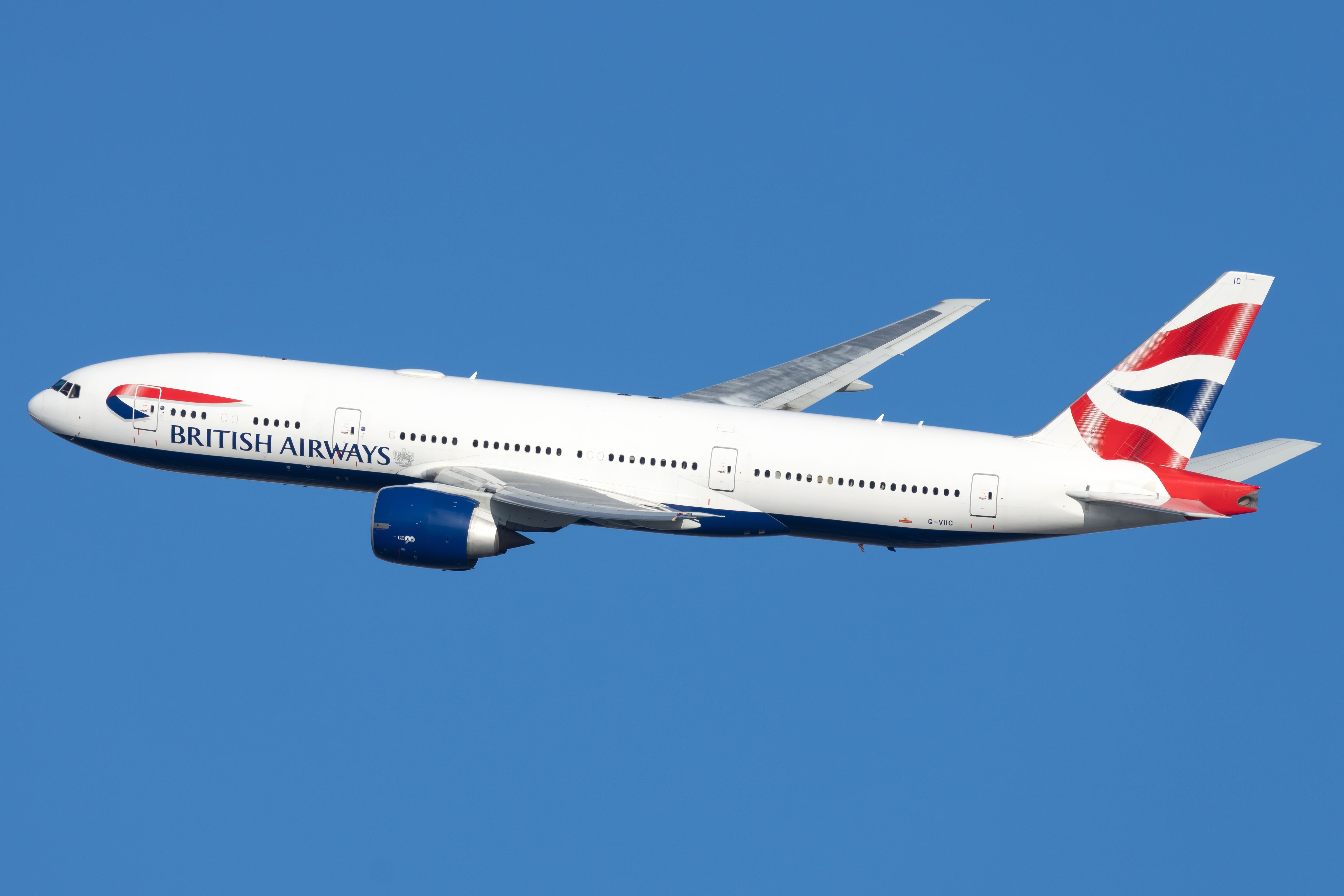 A British Airways Boeing 777-236(ER) flying in the sky.